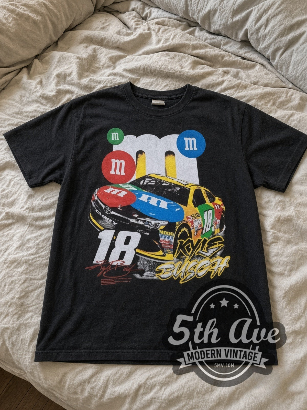 NASCAR Kyle Busch #18 M&M's Characters all-over-print vintage NASCAR tee in black laid flat