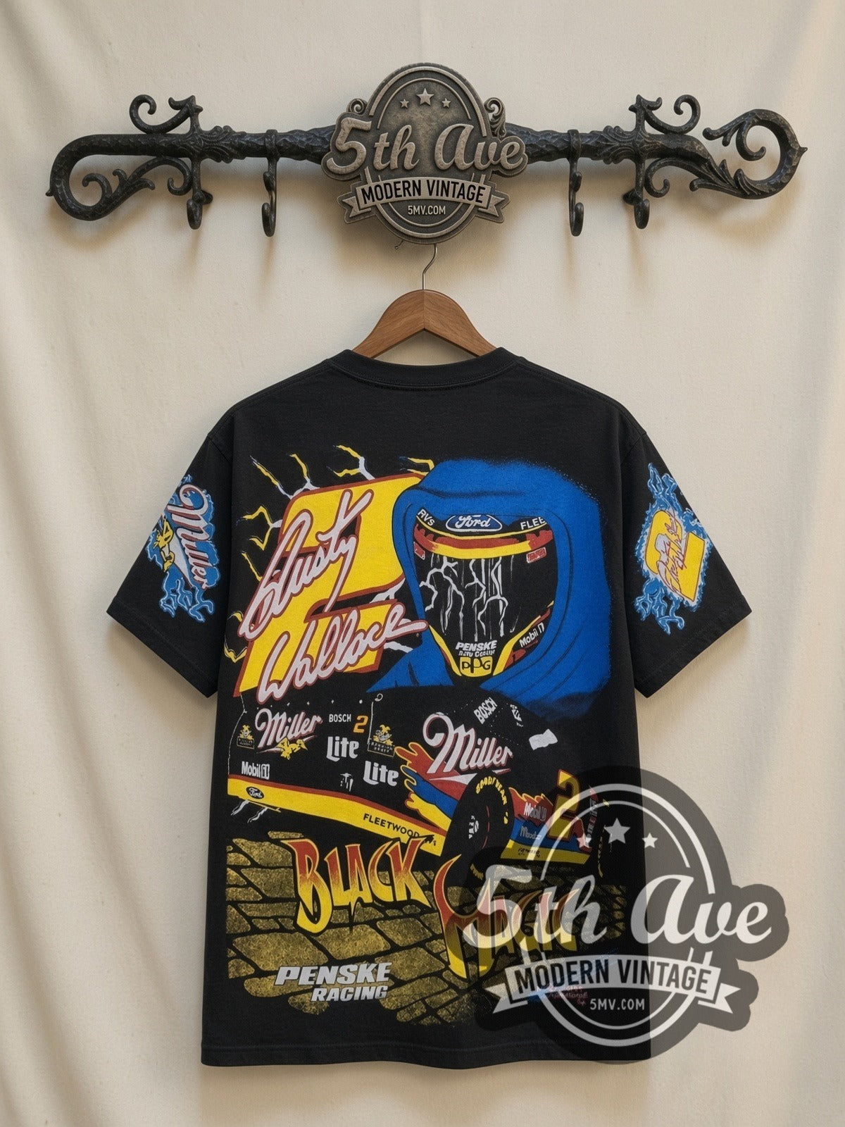 NASCAR Rusty Wallace #2 Black Magic Miller all-over-print vintage NASCAR t-shirt in black, back view on a display rack