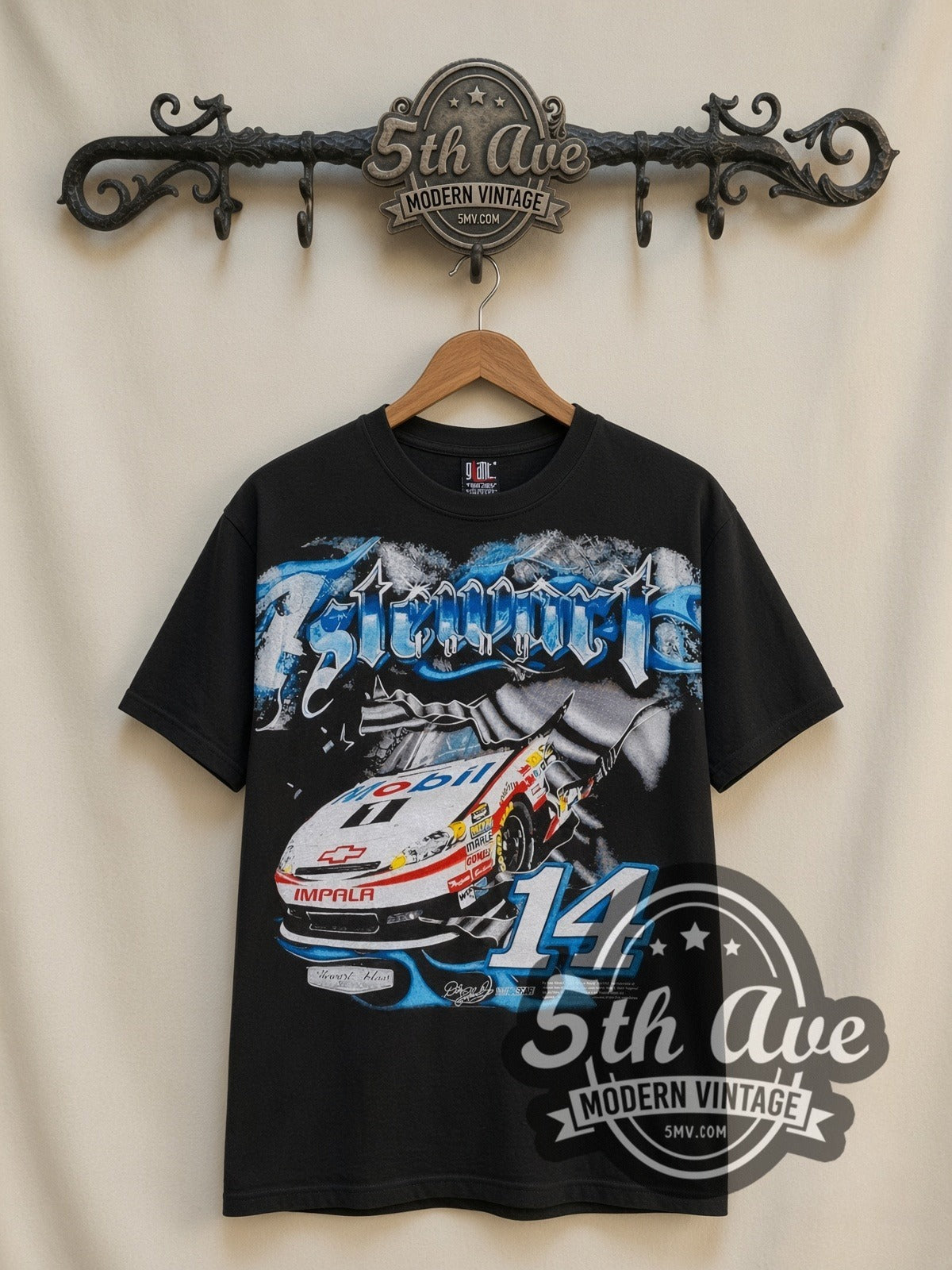 NASCAR Tony Stewart #14 Mobil 1 all-over-print vintage NASCAR t-shirt, front view on a display rack
