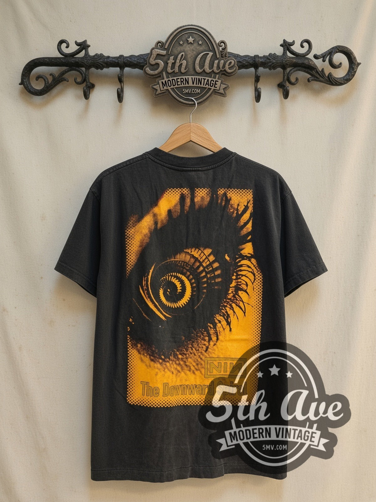 Nine Inch Nails Closer / Downward Spiral vintage band t-shirt, back view on a display rack