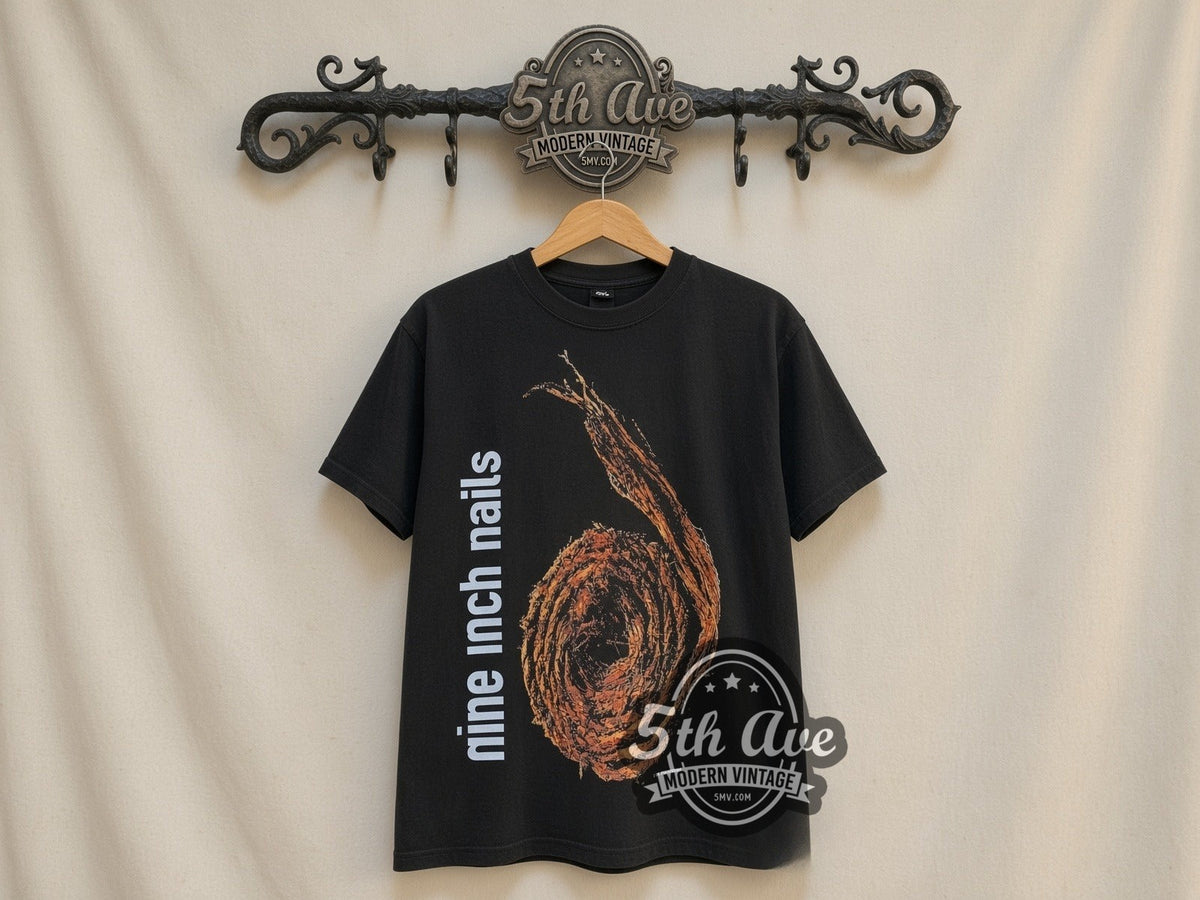 Nine Inch Nails Further Down the Spiral vintage band t-shirt, front view on a display rack