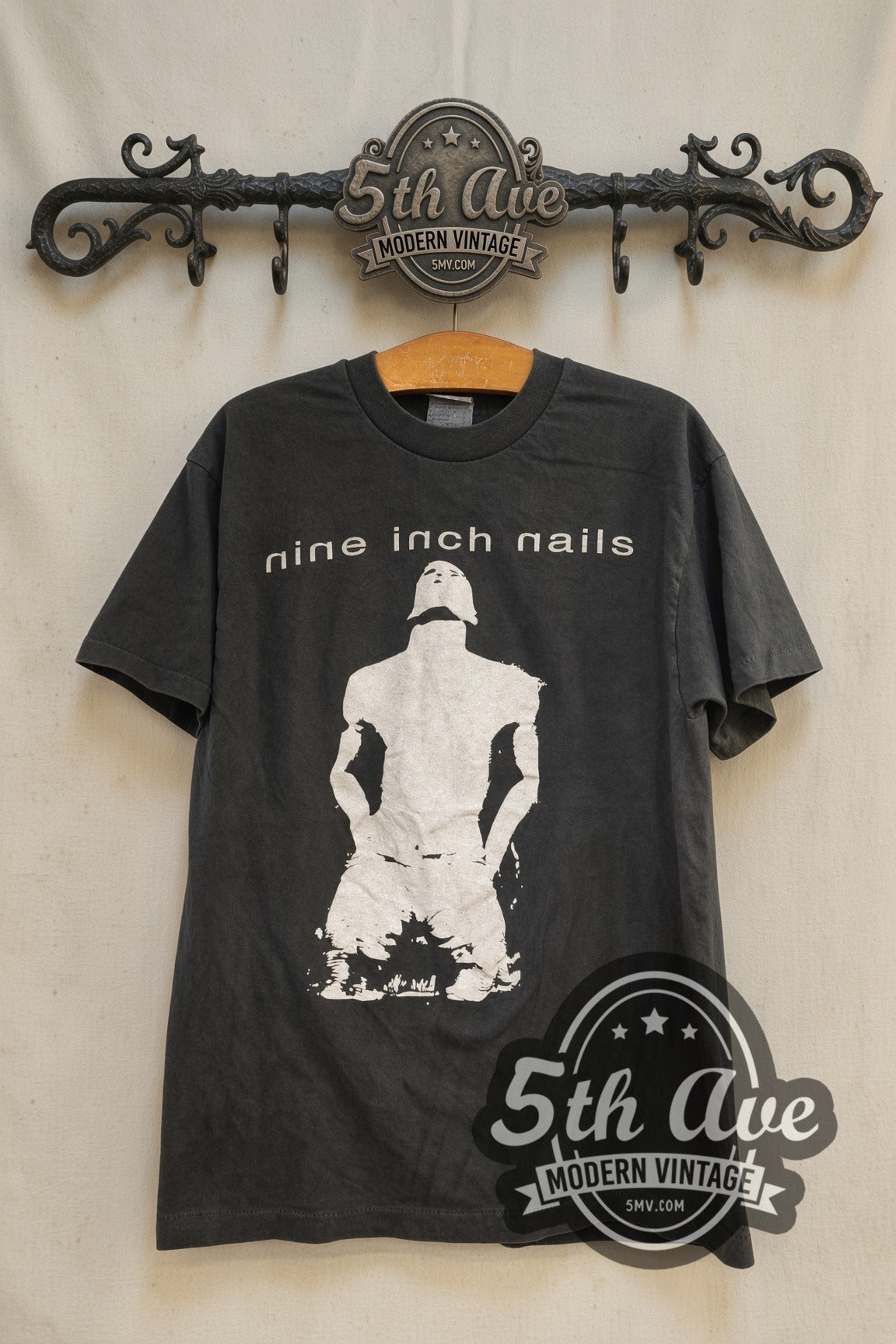 Nine Inch Nails Kneeling Figure NIN Logo vintage band t-shirt, front view on the 5MV rack
