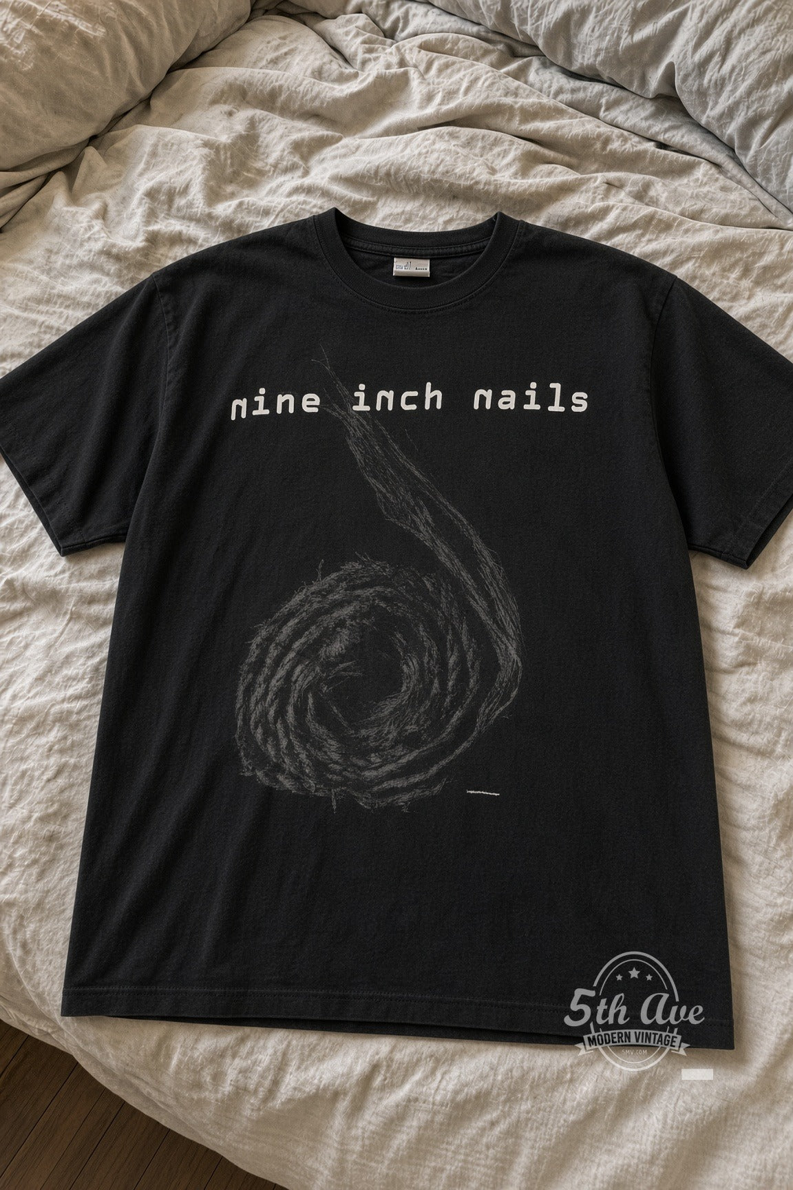 Nine Inch Nails Spiral Goddamn This Noise Inside My Head vintage tee laid flat on bed