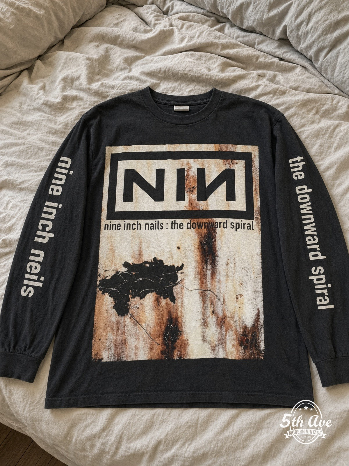 Nine Inch Nails The Downward Spiral Nothing Records Long Sleeve vintage tee laid on bed