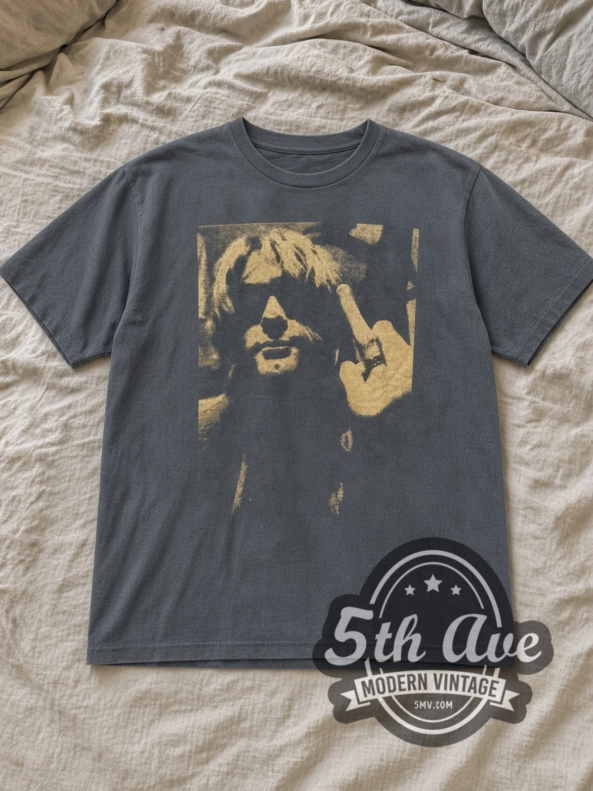 Charcoal Nirvana A Rare to the Grunge Icon Vintage Band T-Shirt laid flat on a linen bed