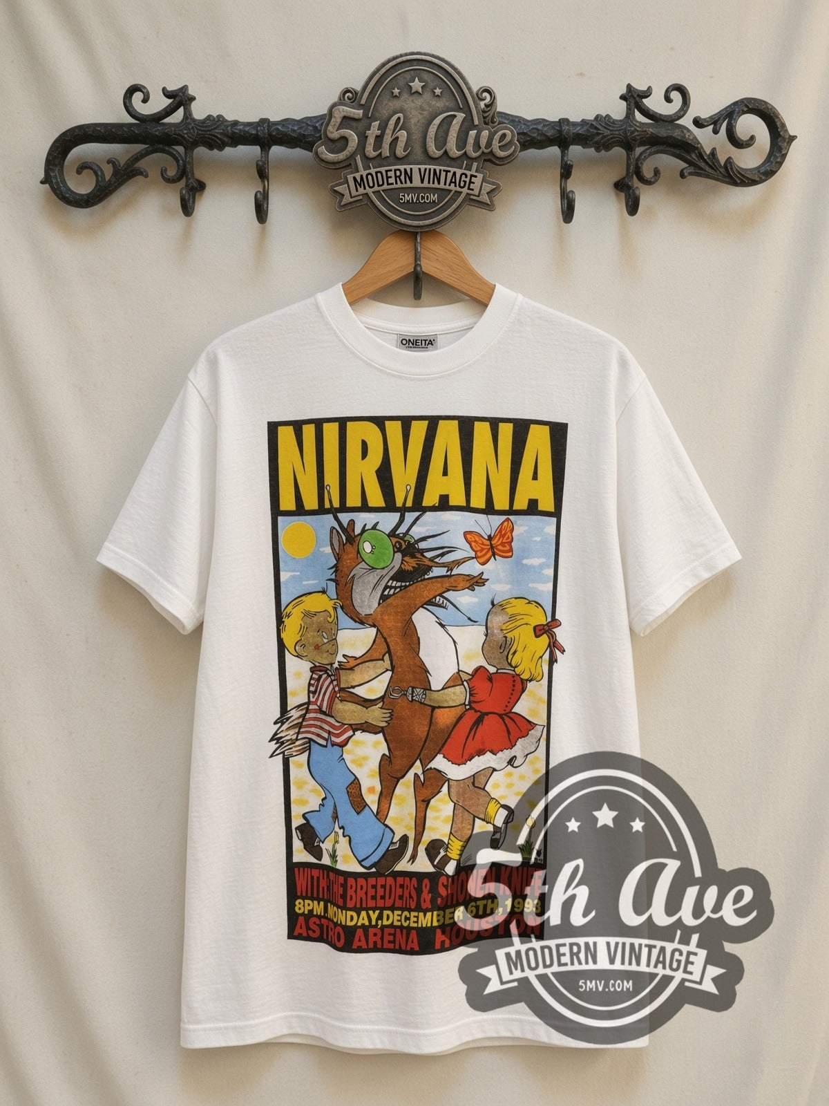 Nirvana Astro Arena Houston Dec 6 1993 vintage band t-shirt, front view on a display rack