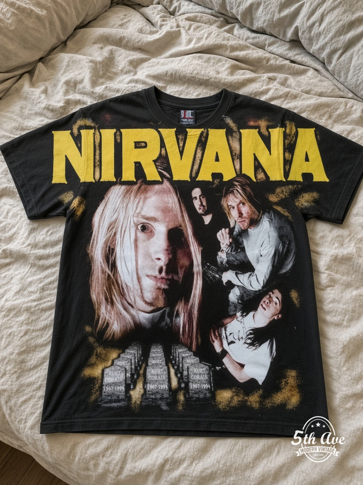 Nirvana Collage Yellow Logo all over print vintage tee laid on bed