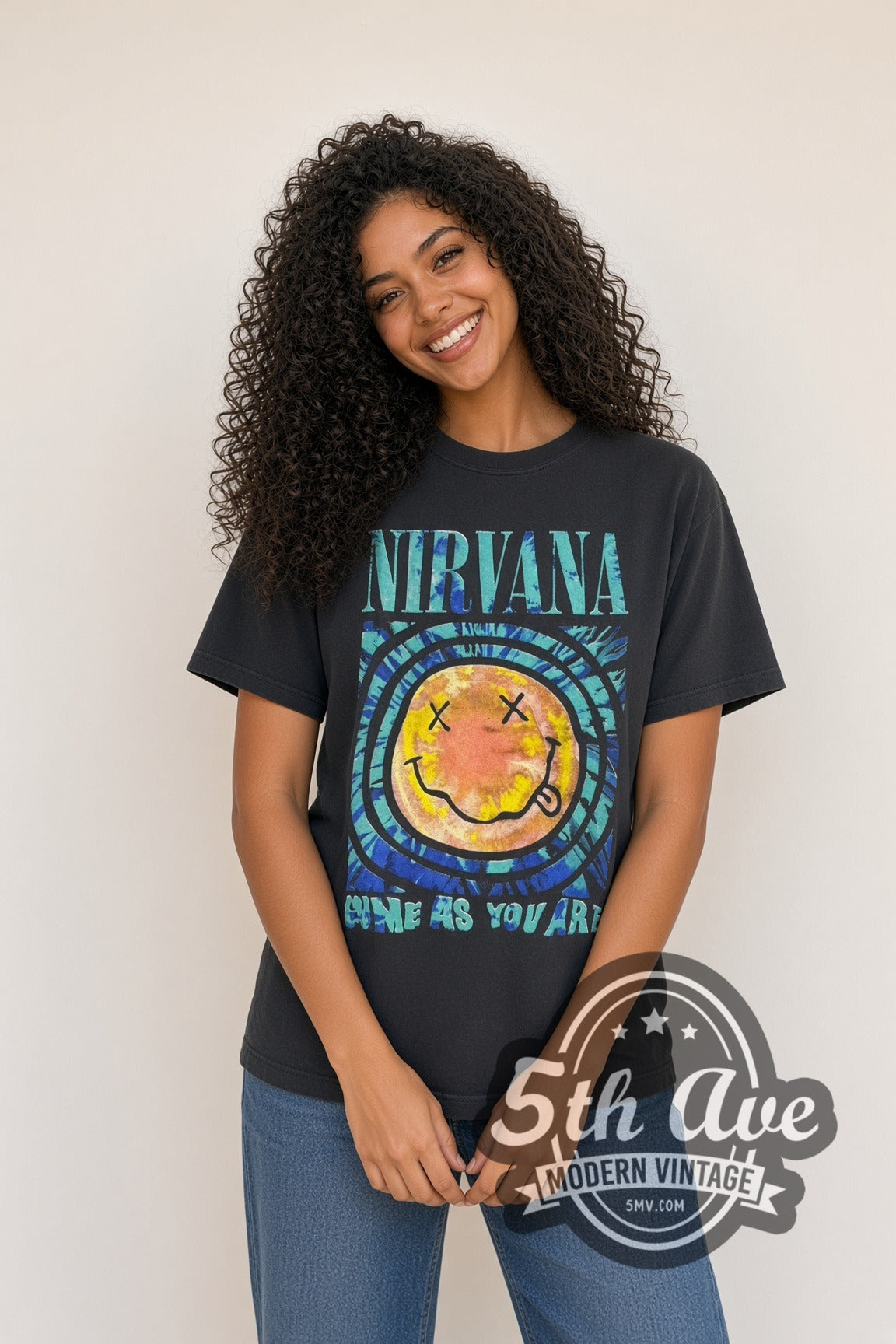Woman wearing faded black Nirvana Come As You Are Psychedelic Smiley & Box Logo vintage band t-shirt