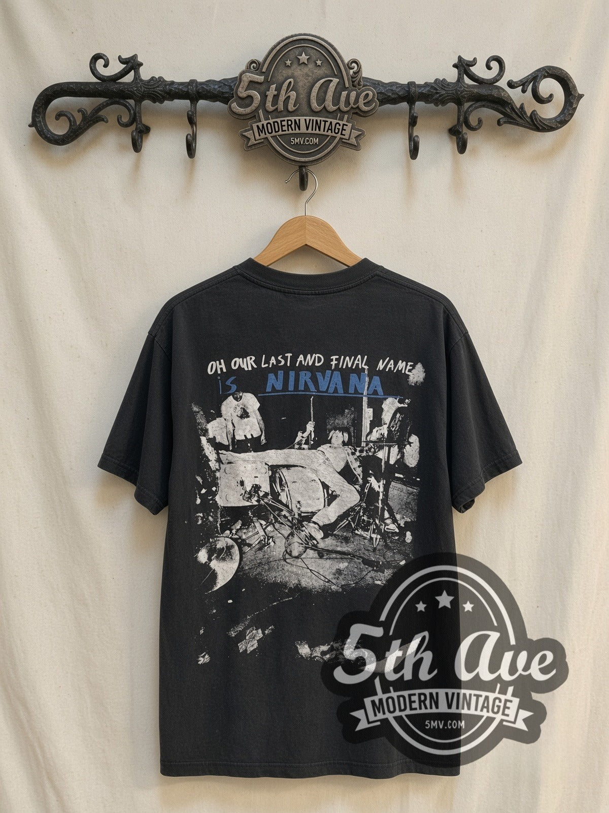 Nirvana Dumb / Oh Our Last and Final Name vintage band t-shirt, back view on a display rack