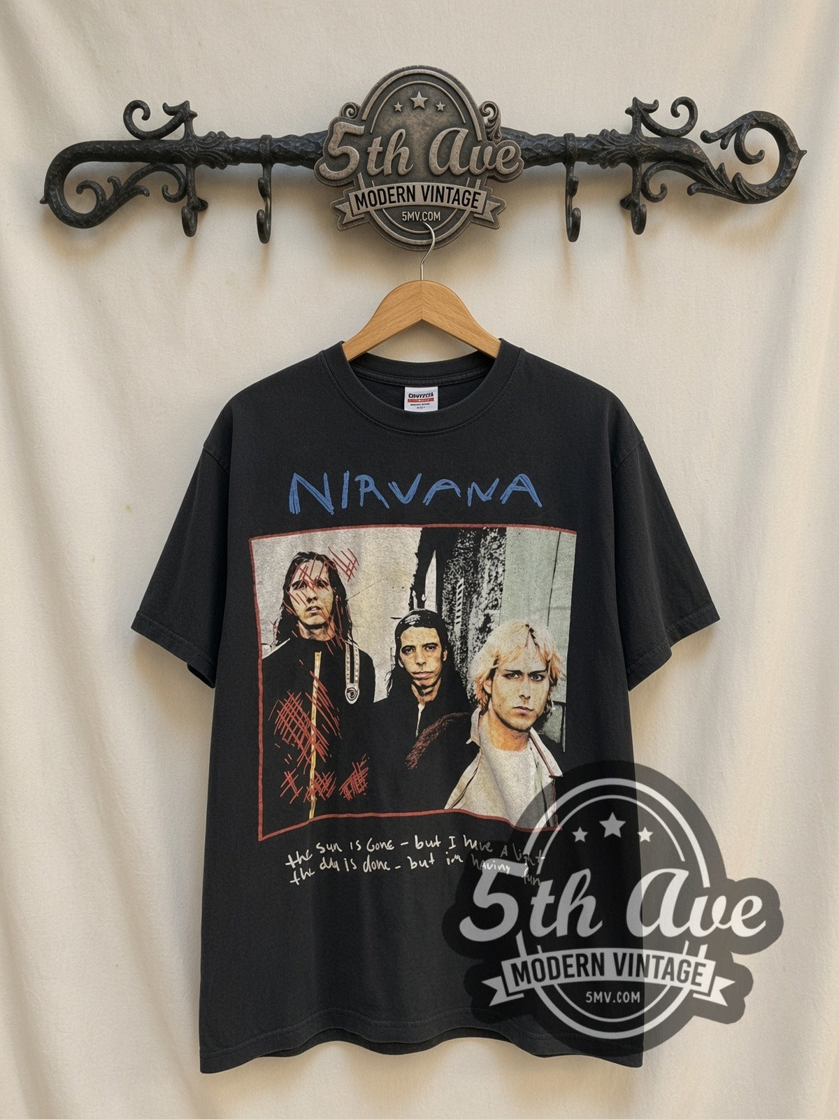 Nirvana Dumb / Oh Our Last and Final Name vintage band t-shirt, front view on a display rack