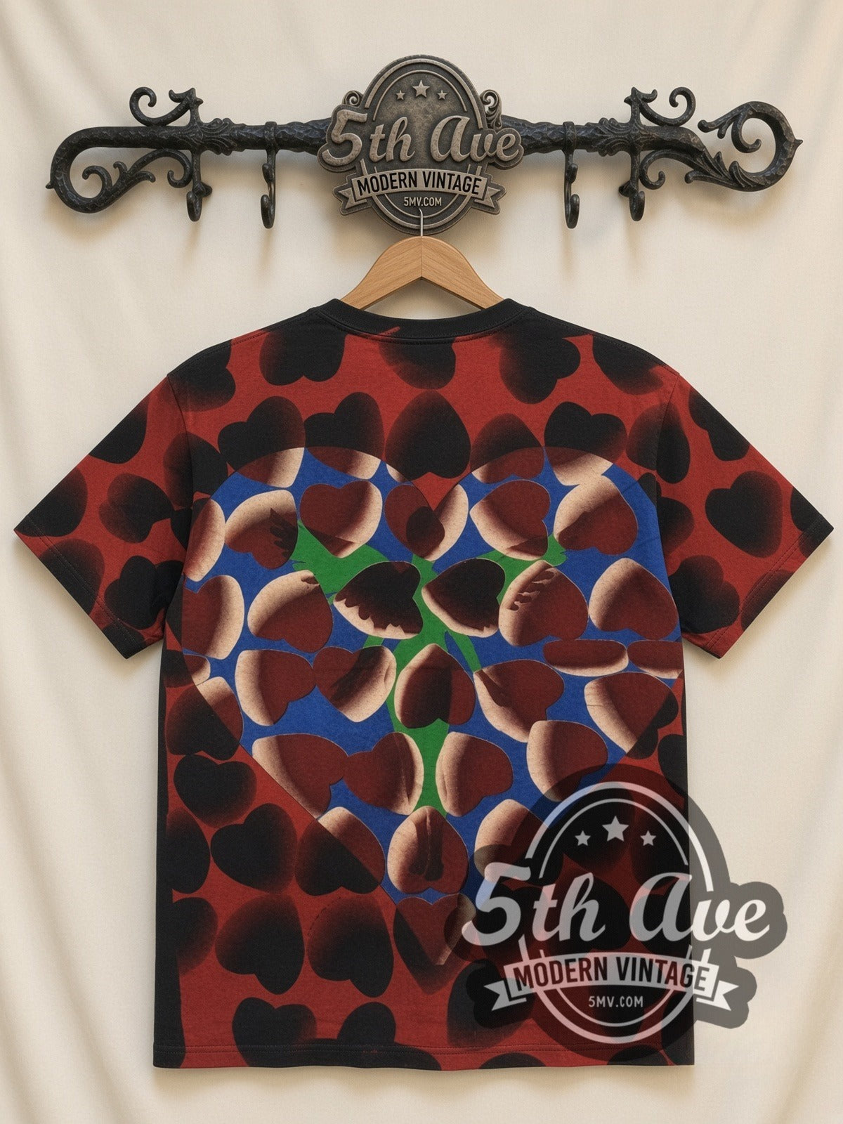 Nirvana Heart Lilies all-over-print vintage band t-shirt in black, back view on a display rack