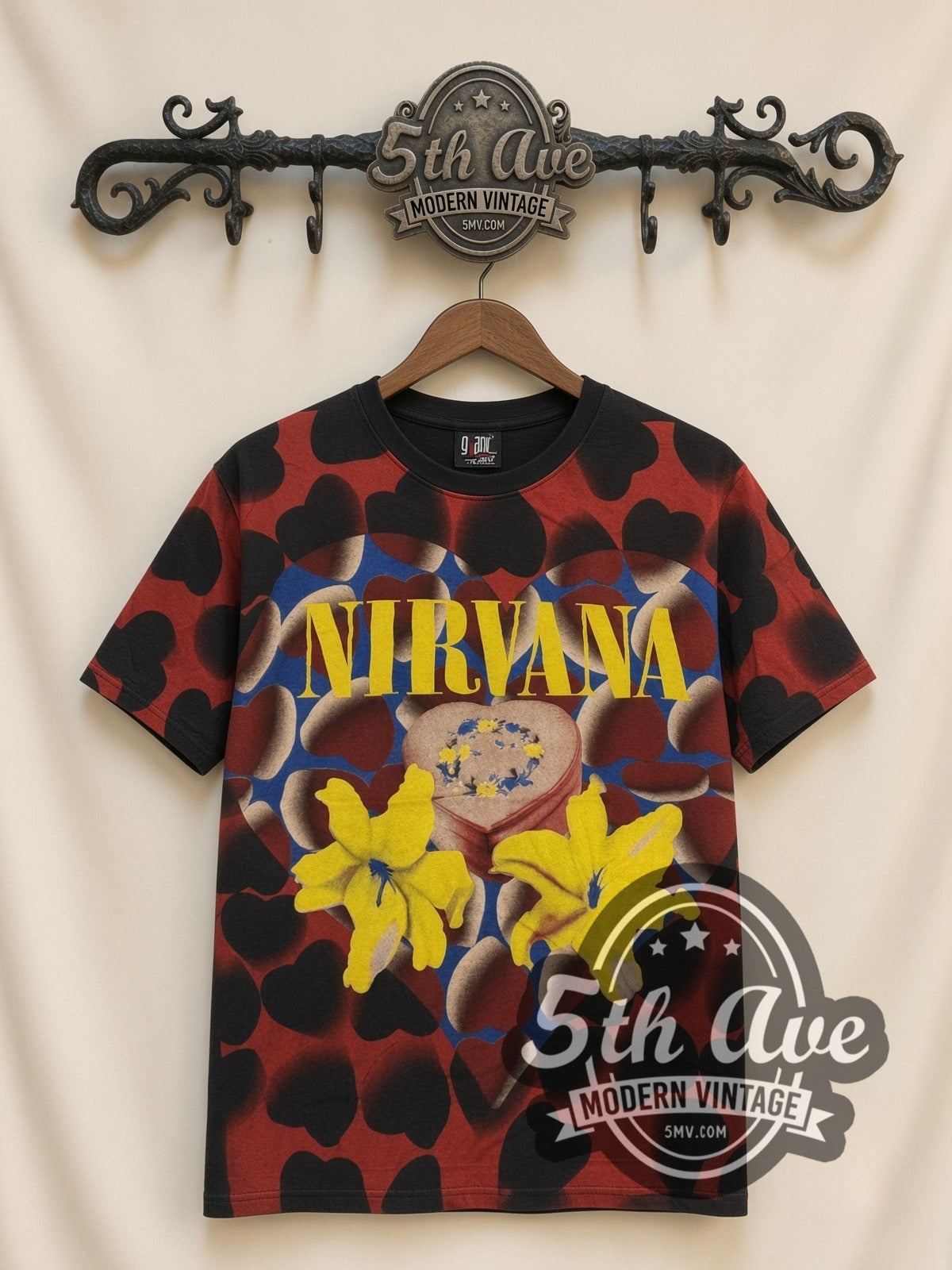 Nirvana Heart Lilies all-over-print vintage band t-shirt in black, front view on a display rack