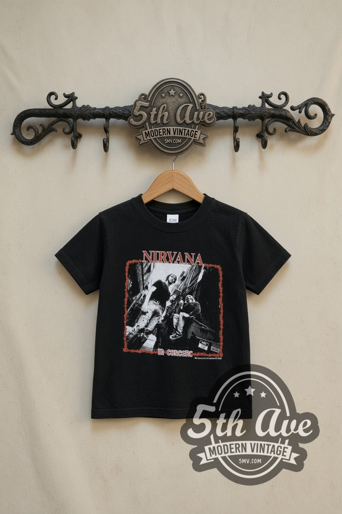 Nirvana In Concert Band Photo kids band tee in black, front view on a display rack