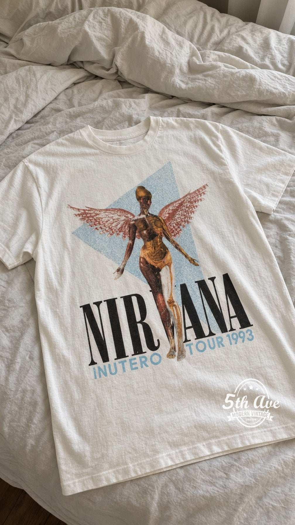 Nirvana In Utero Tour 1993 vintage t-shirt laid on bed