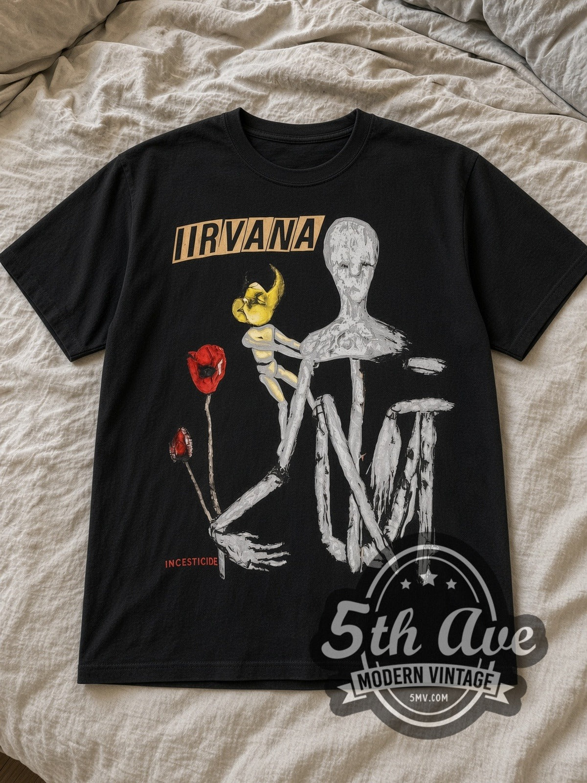 Black Nirvana Incesticide Black Back Print Vintage Band T-Shirt laid flat on a linen bed