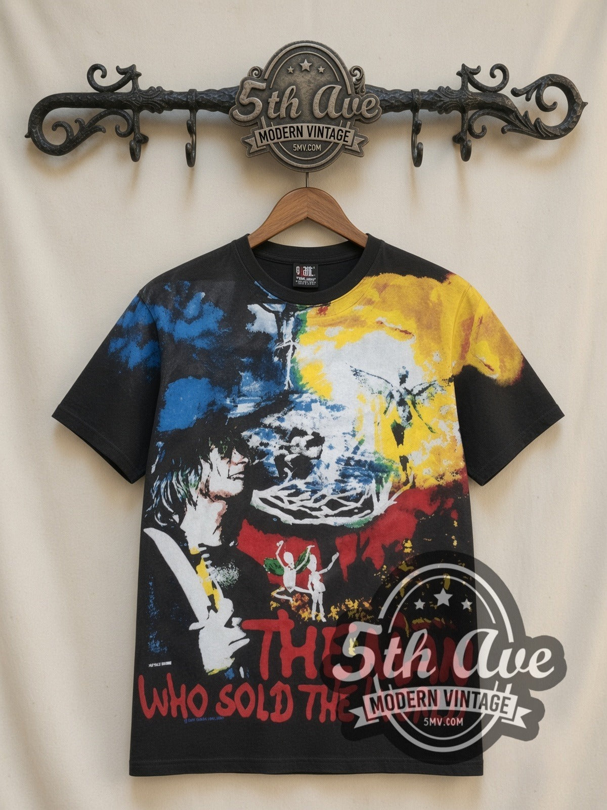 Nirvana Man Who Sold The World all-over-print vintage band t-shirt in black, front view on a display rack