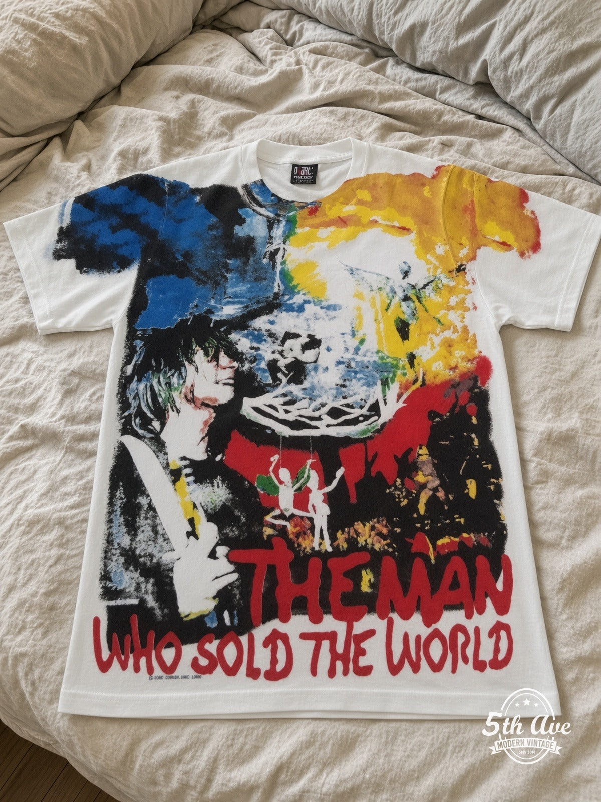 Nirvana Man Who Sold The World all over print vintage tee laid on bed