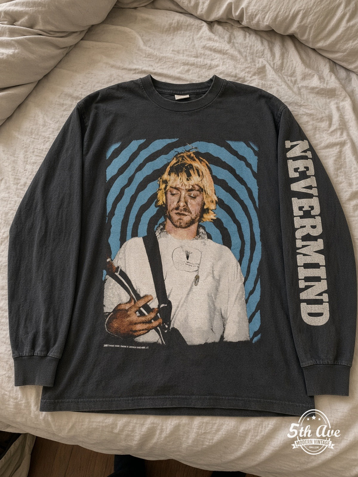 Nirvana Nevermind Kurt Spiral Long Sleeve vintage tee laid on bed