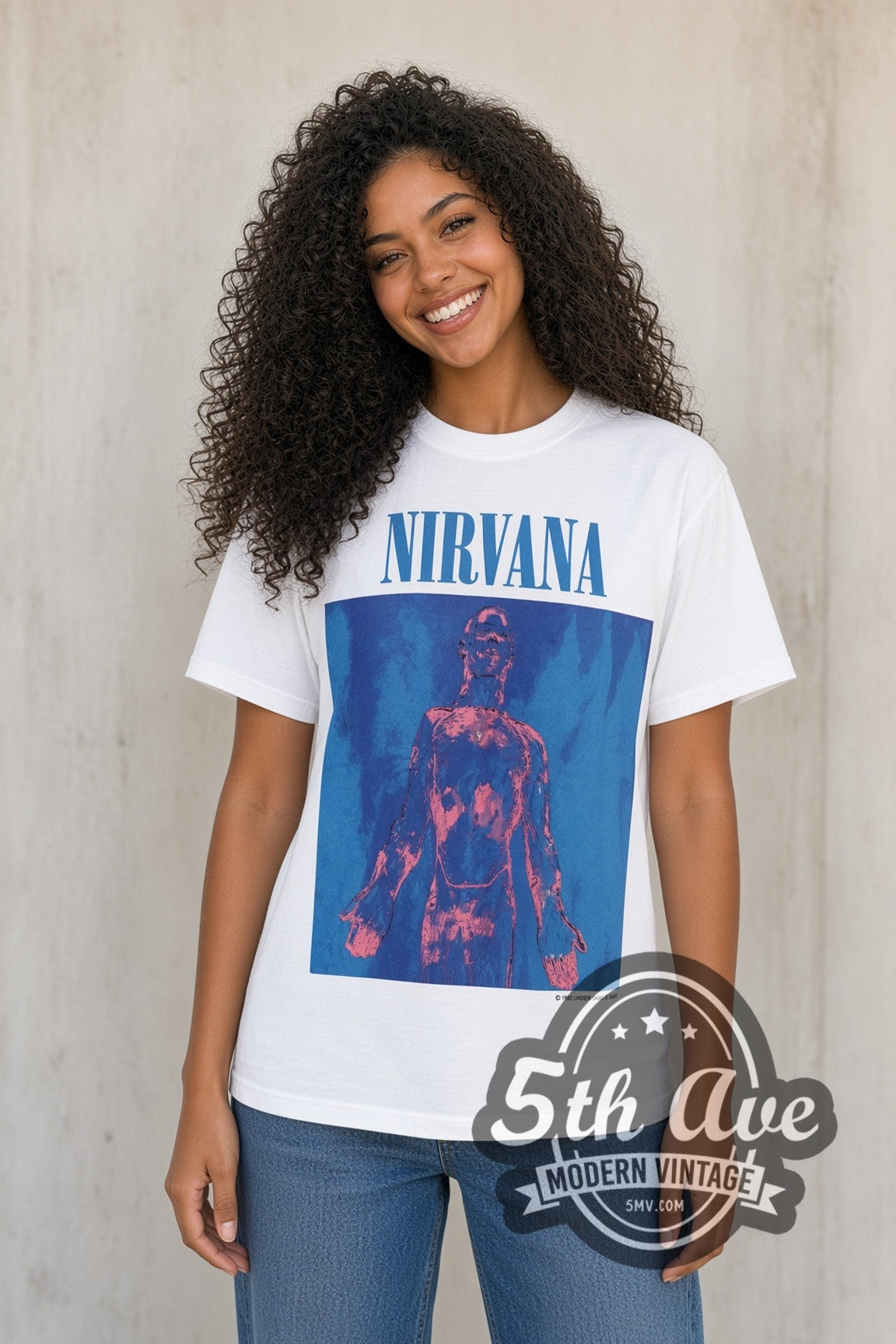 Model wearing the Nirvana Sliver vintage band t-shirt in white with jeans