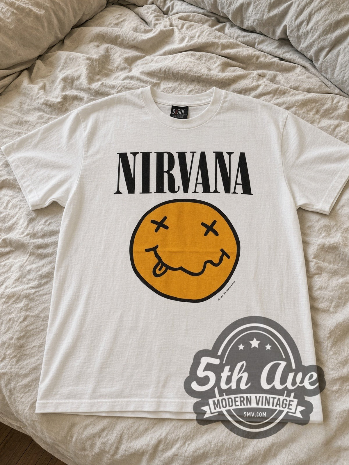 Nirvana Yellow Smiley / Butthole Surfers vintage band tee laid flat