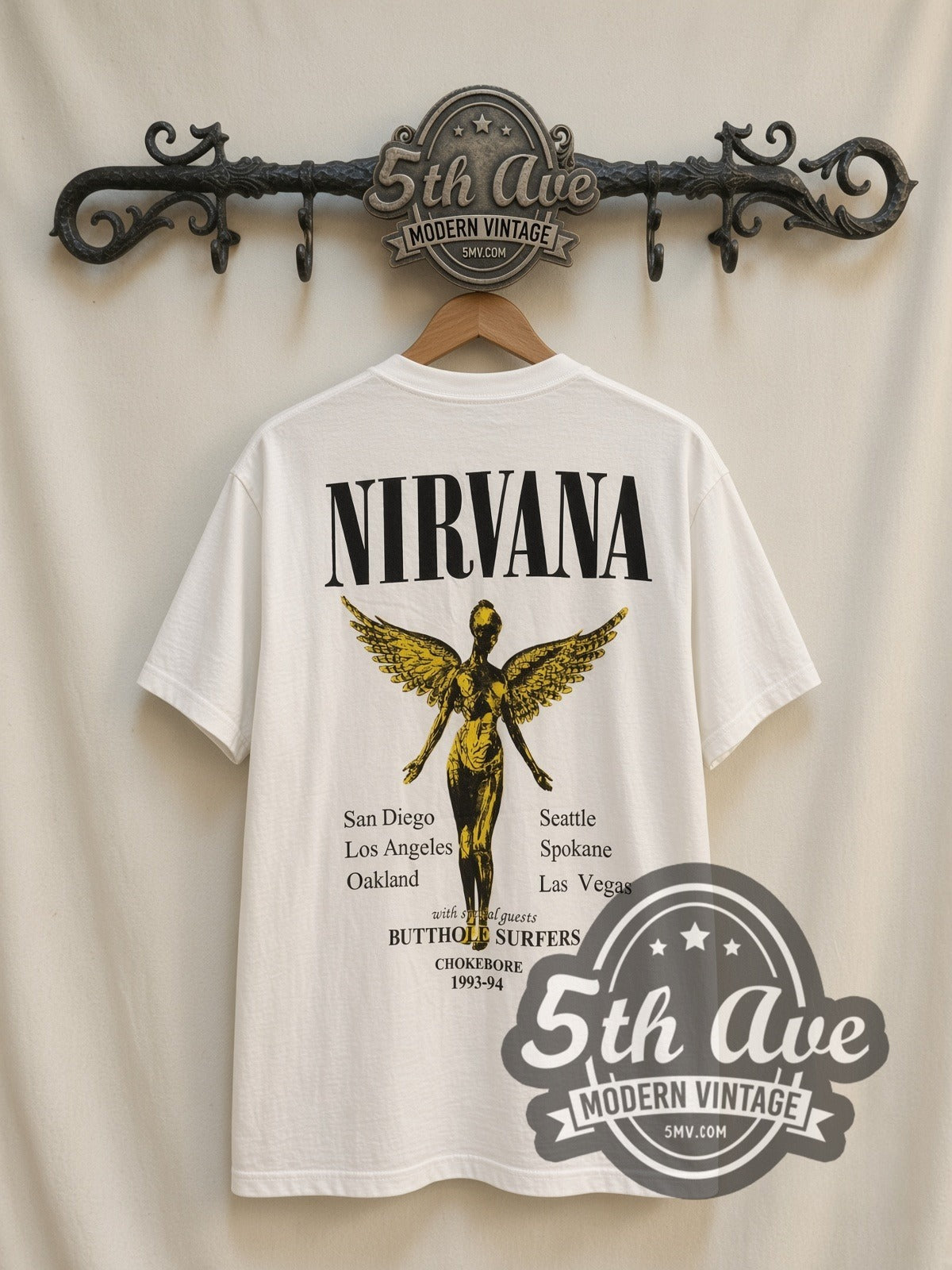 Nirvana Yellow Smiley / Butthole Surfers vintage band t-shirt, back view on a display rack