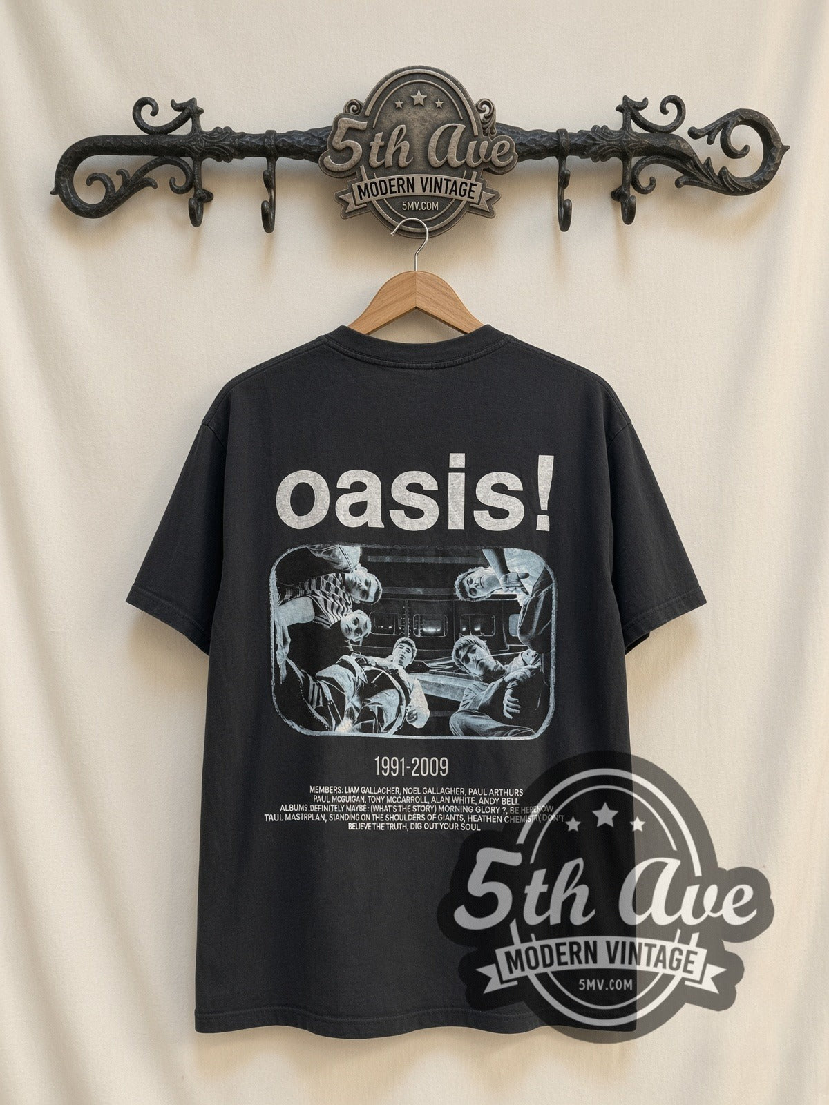 Oasis 1991-2009 Gallagher vintage band t-shirt, back view on a display rack