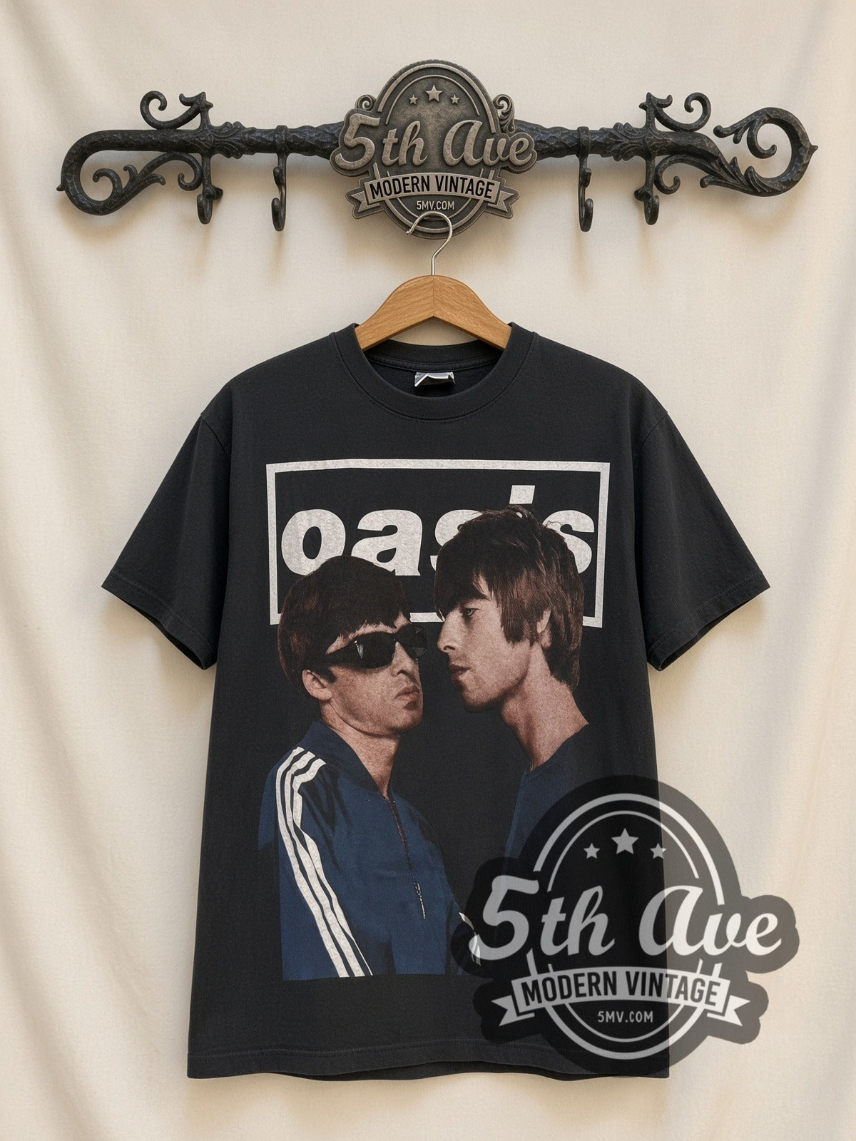 Oasis 1991-2009 Gallagher vintage band t-shirt, front view on a display rack