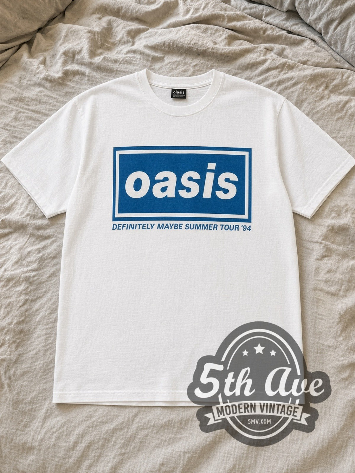 White Oasis Definitely Maybe Summer Tour 1994 Vintage Band T-Shirt laid flat on a linen bed