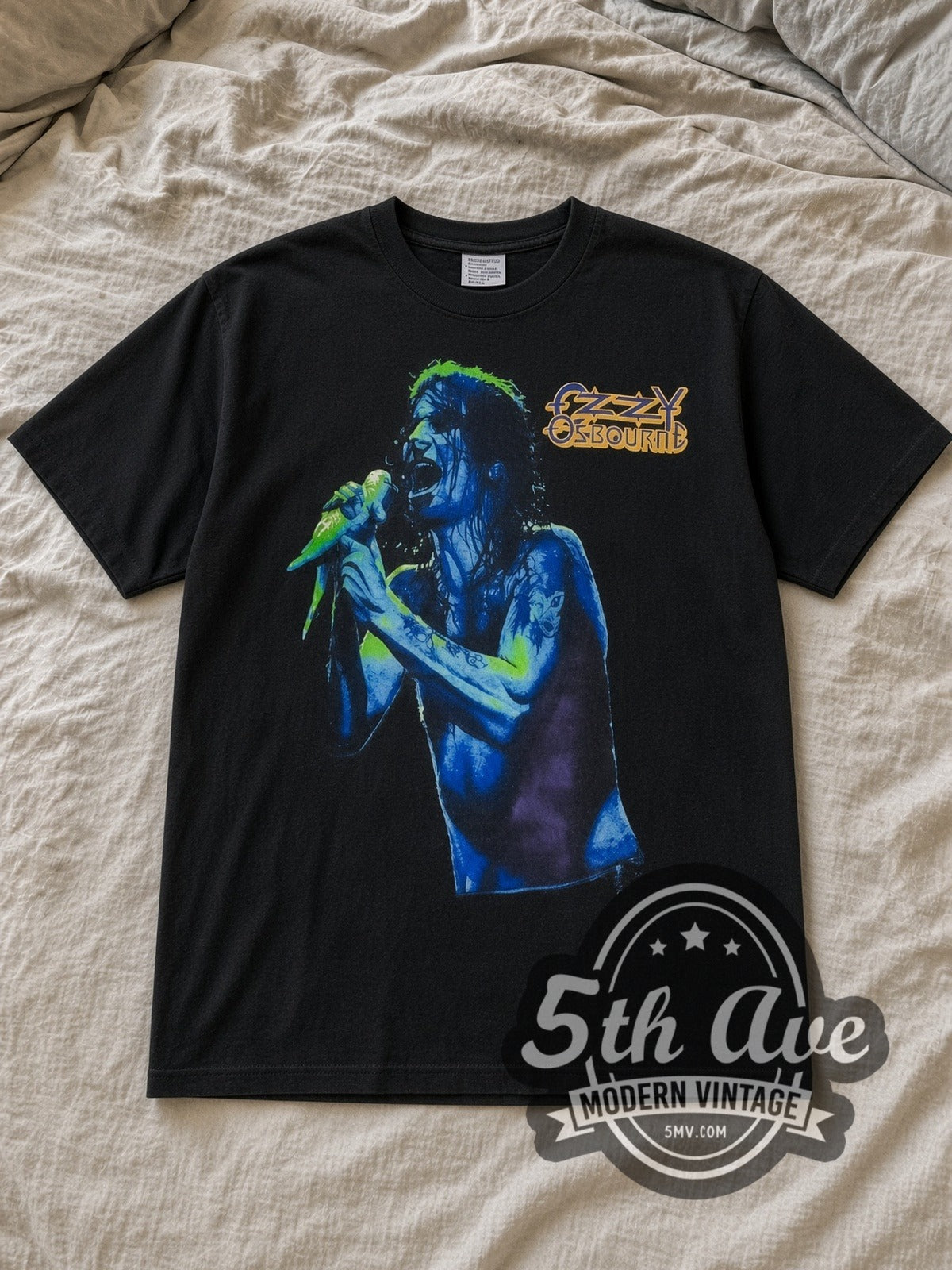 Black Ozzy Osbourne Dove Mic Blue Portrait Severed Head Vintage Band T-Shirt laid flat on a linen bed