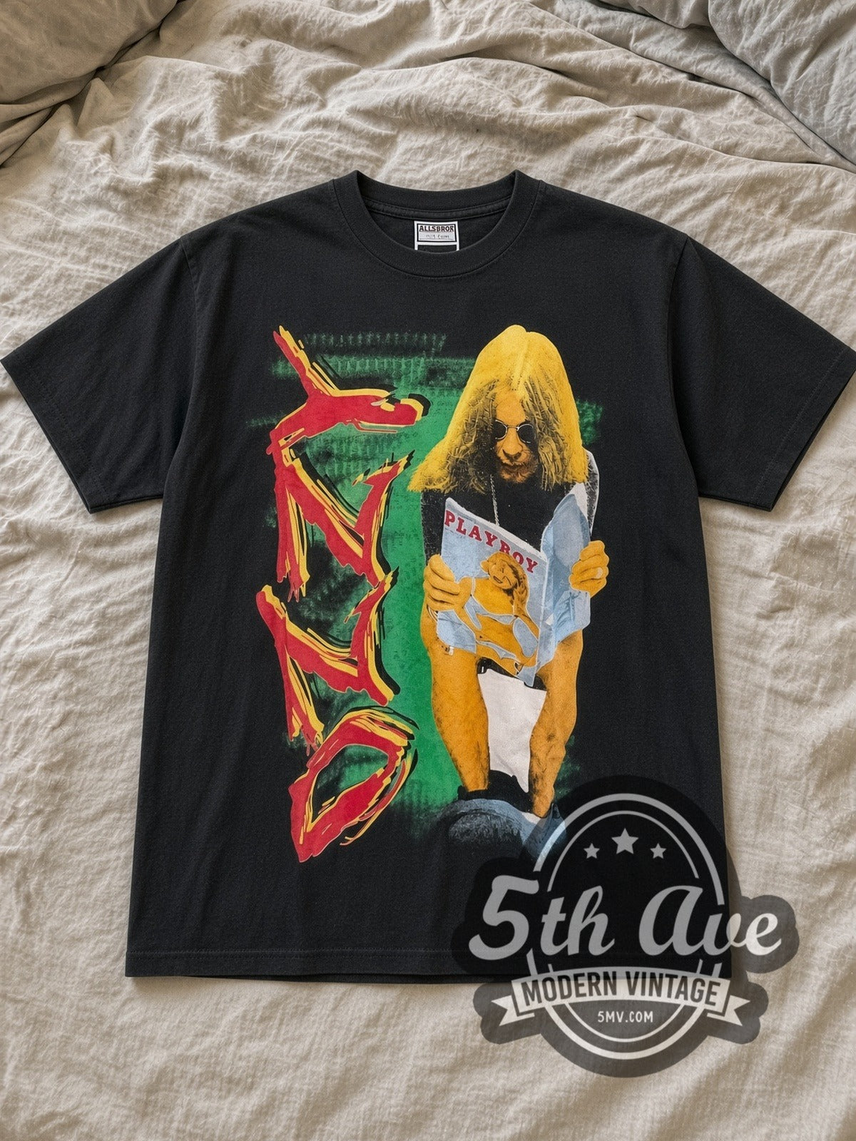 Black Ozzy Osbourne Playboy Vintage Band T-Shirt laid flat on a linen bed