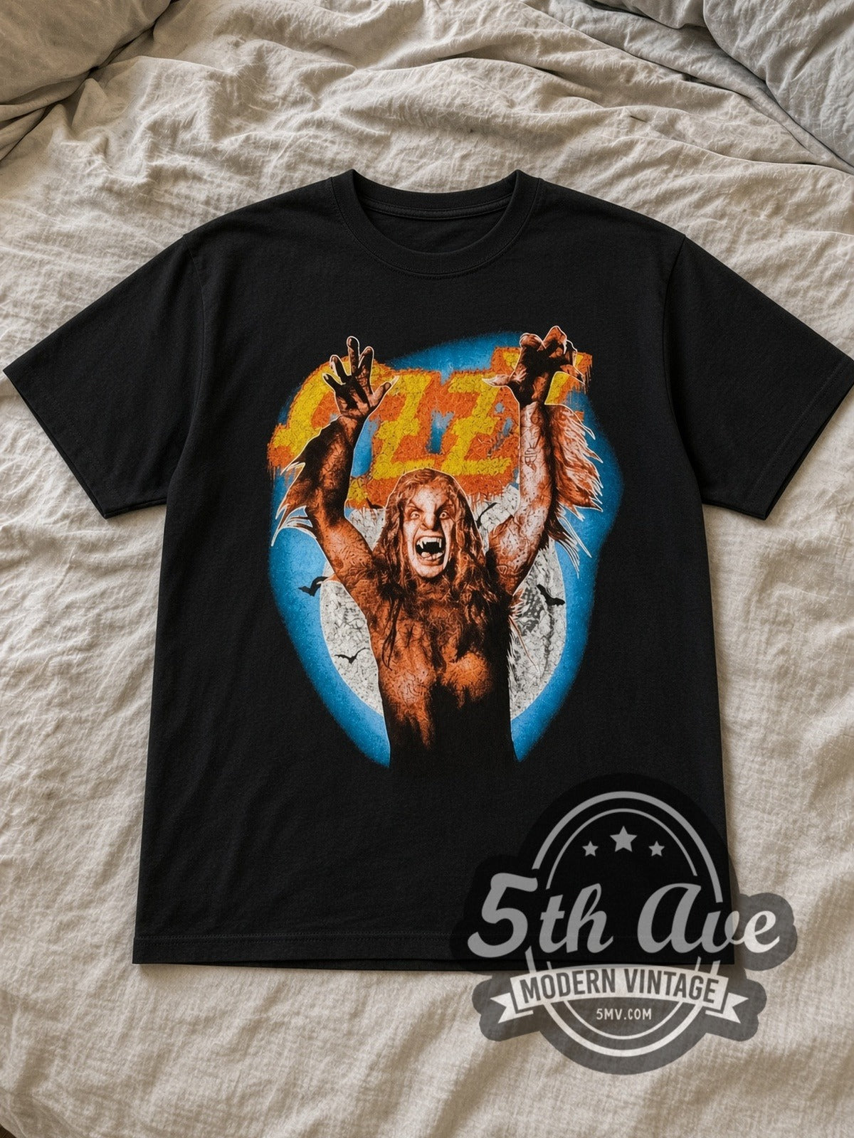 Black Ozzy Osbourne RULES 1984 Bark at the Moon Vintage Band T-Shirt laid flat on a linen bed