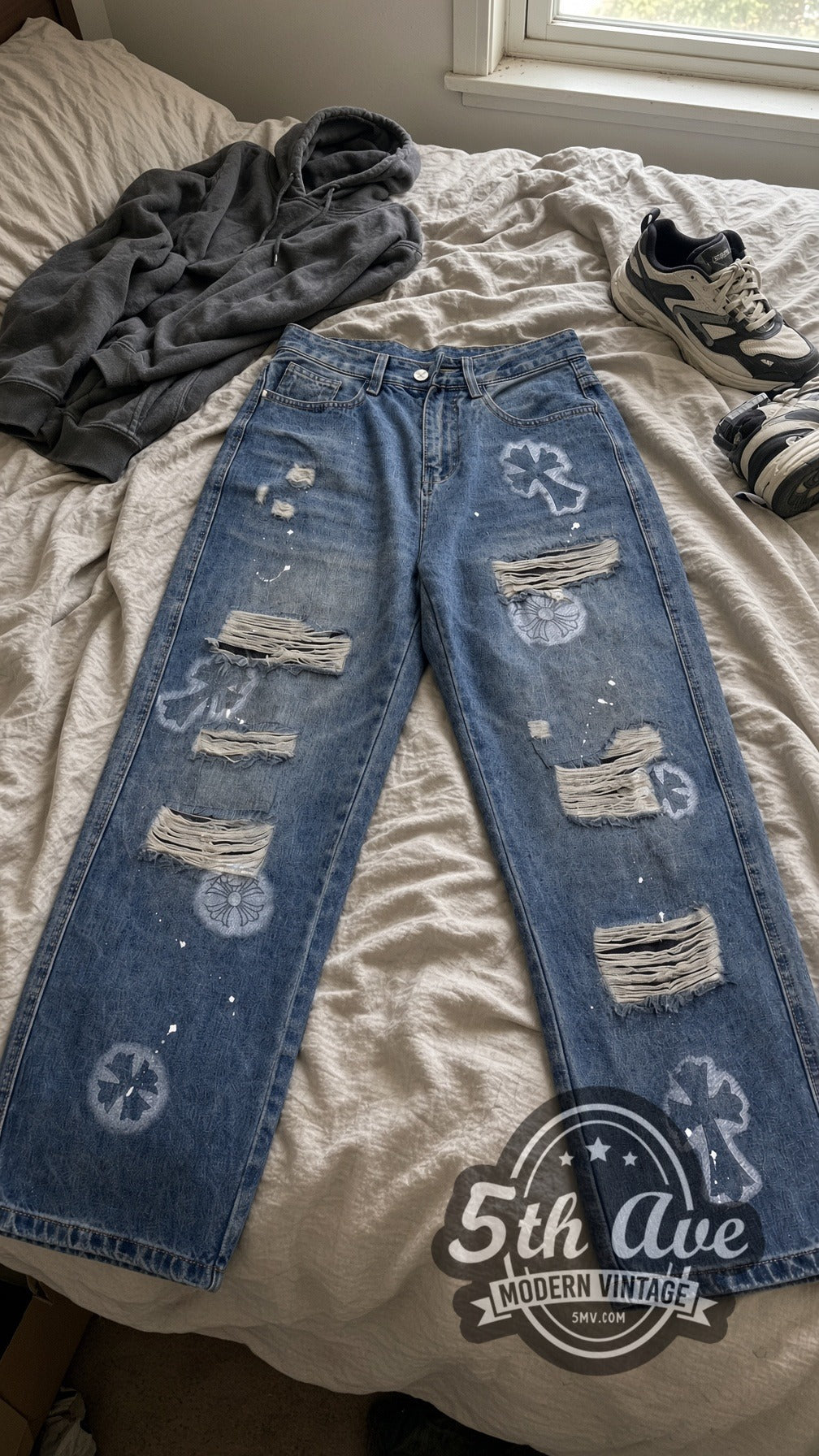 Light Cemetery Cross Floral Distressed Jeans – Vintage Streetwear vintage jeans laid on bed
