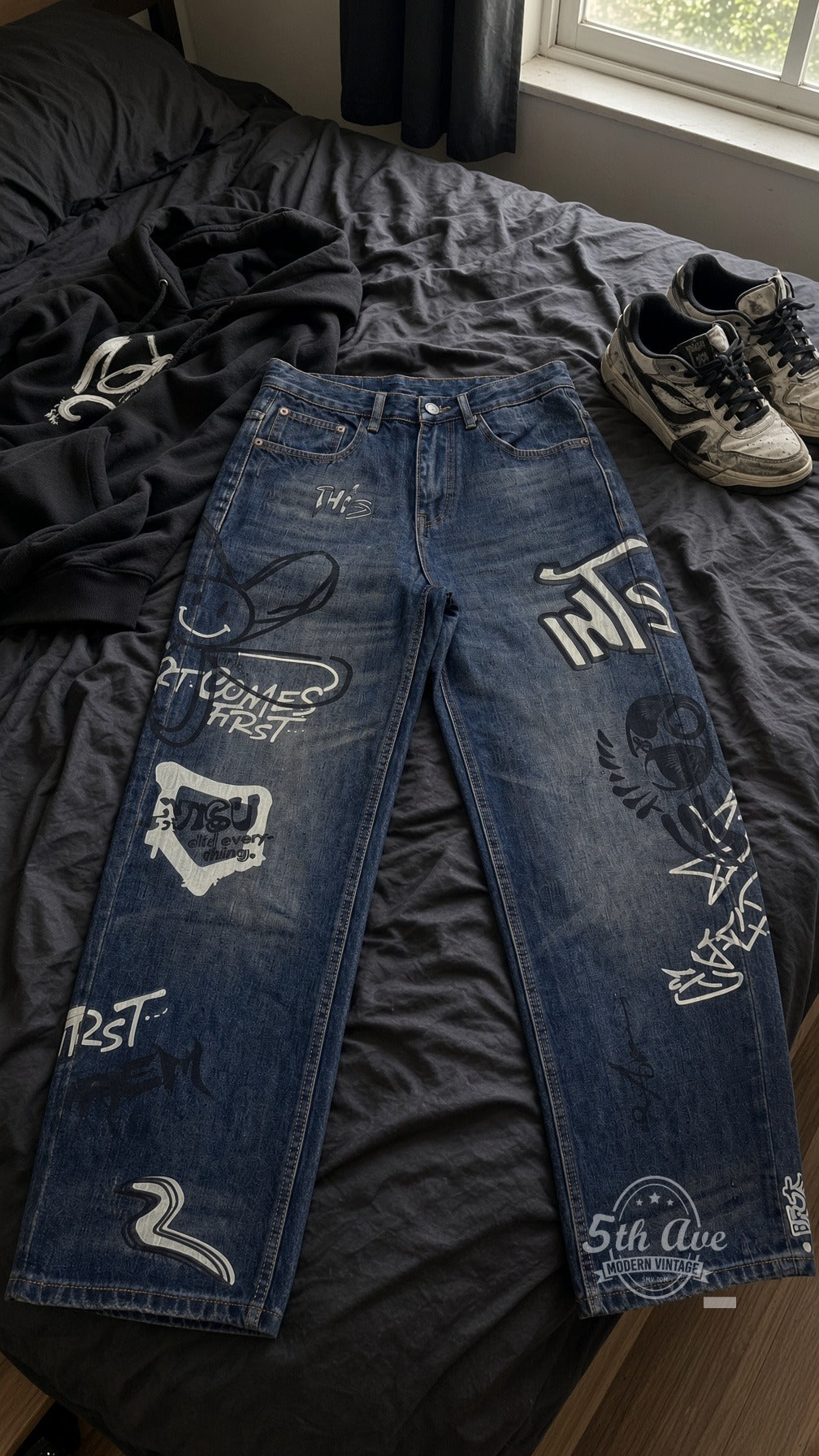 Dark Graffiti Bunny Skull Streetwear Jeans laid on bed