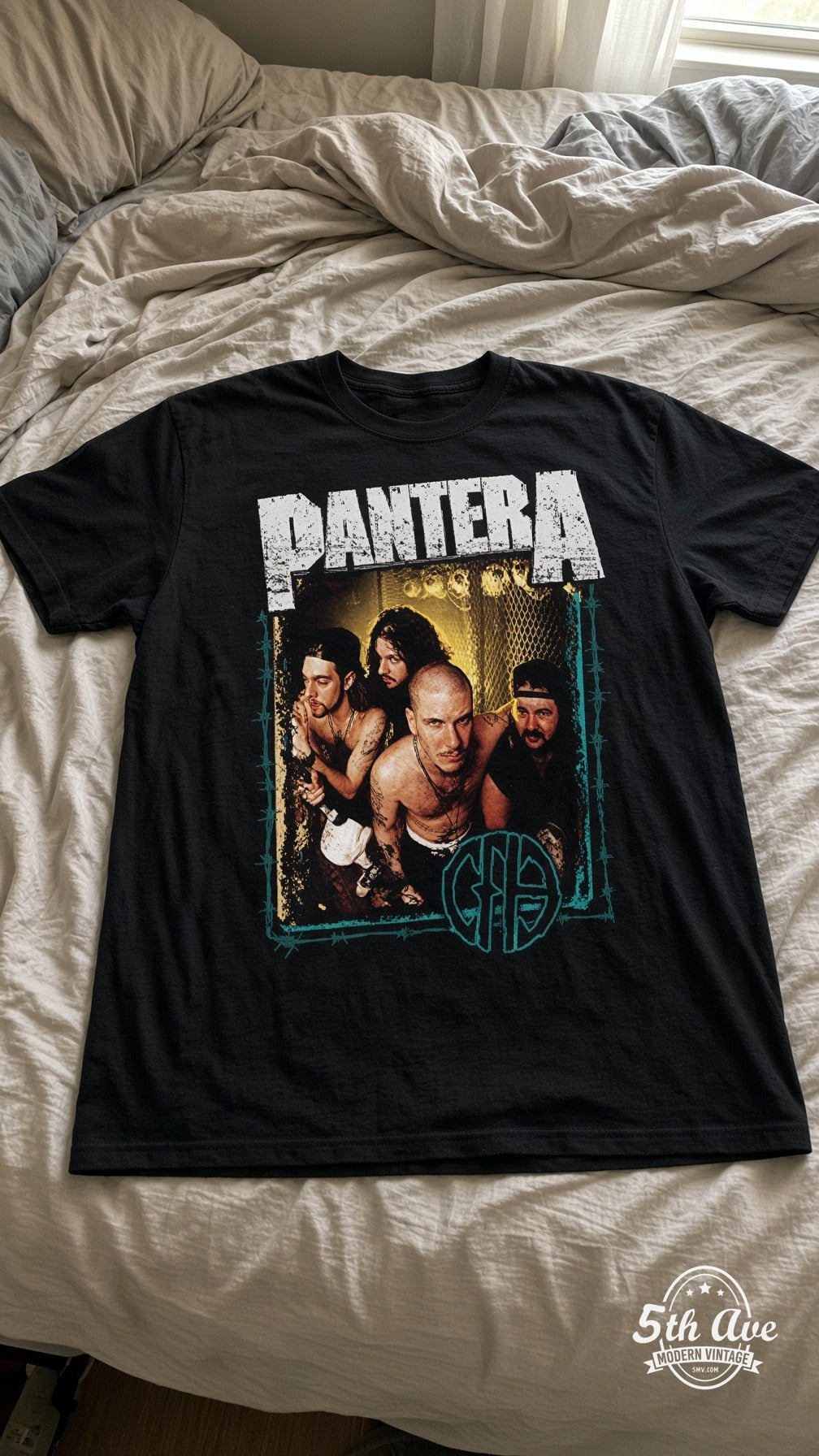 Pantera Cowboys From Hell vintage t-shirt laid on bed