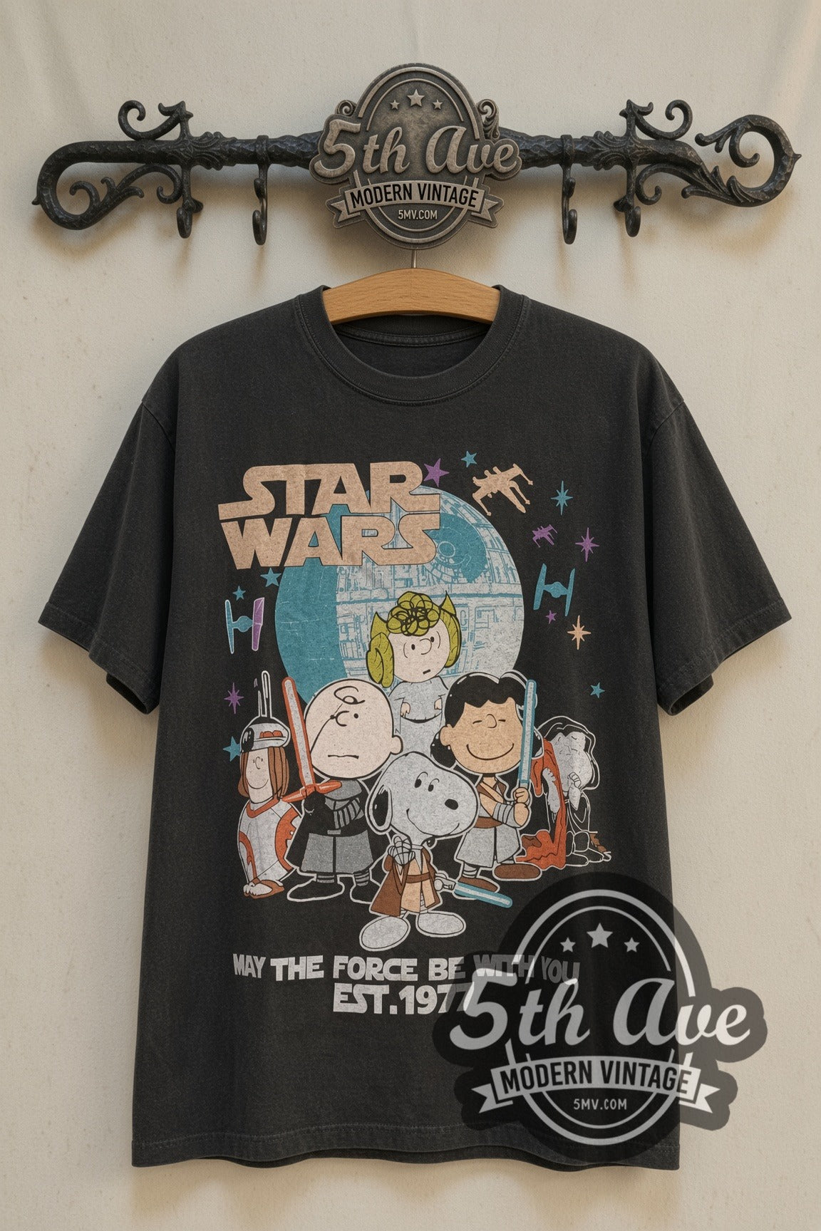 Peanuts x Star Wars May the Force Be With You Est. 1977 cartoon tee front on 5th Ave iron rack