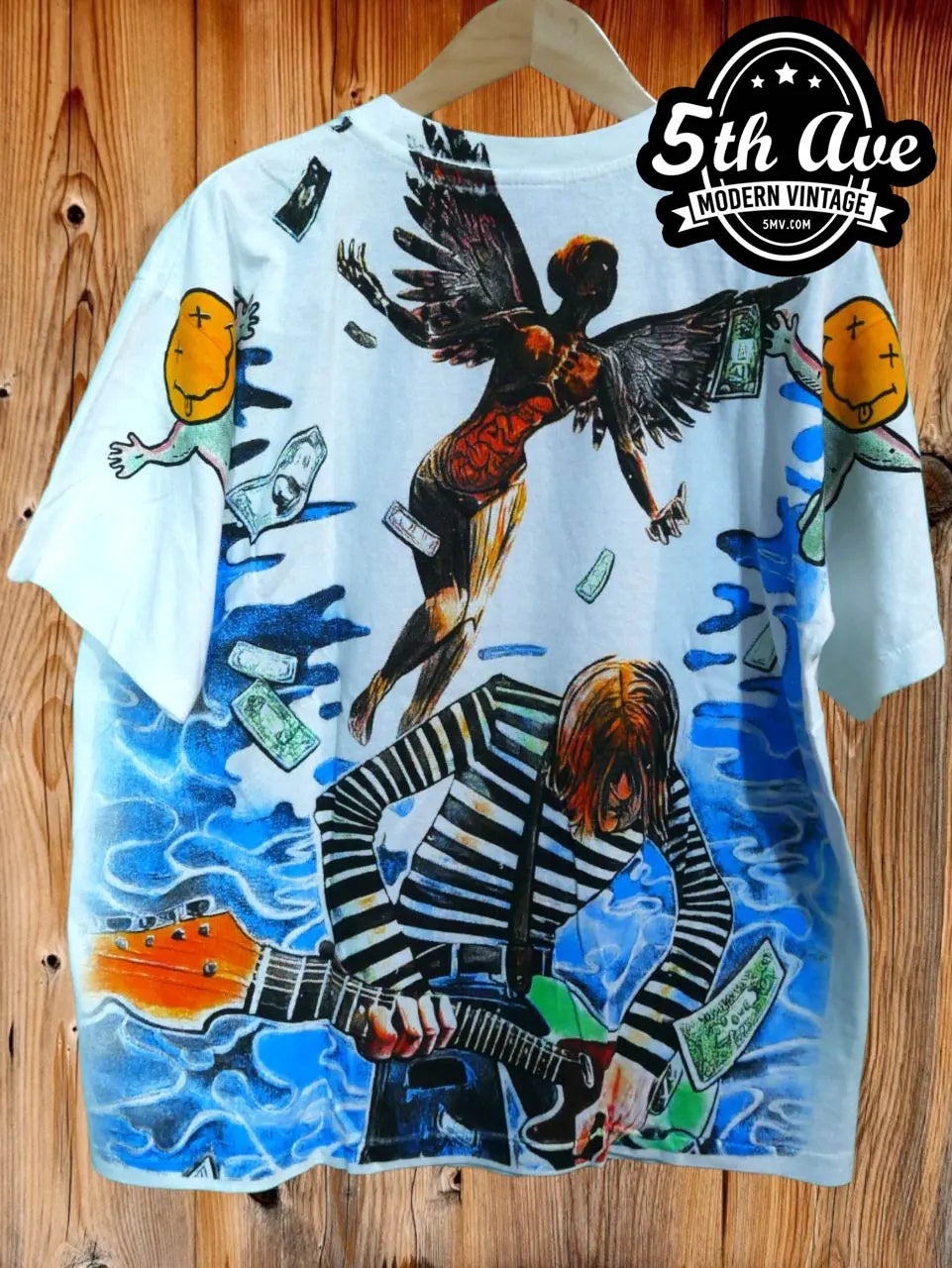 Nirvana – Collage vintage t-shirt laid on bed