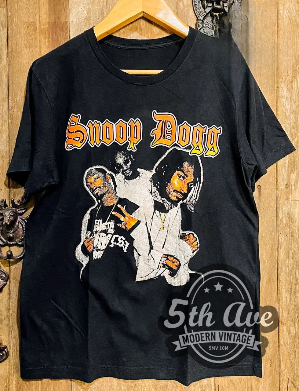 Snoop Dogg vintage rap tee, front view on a display rack