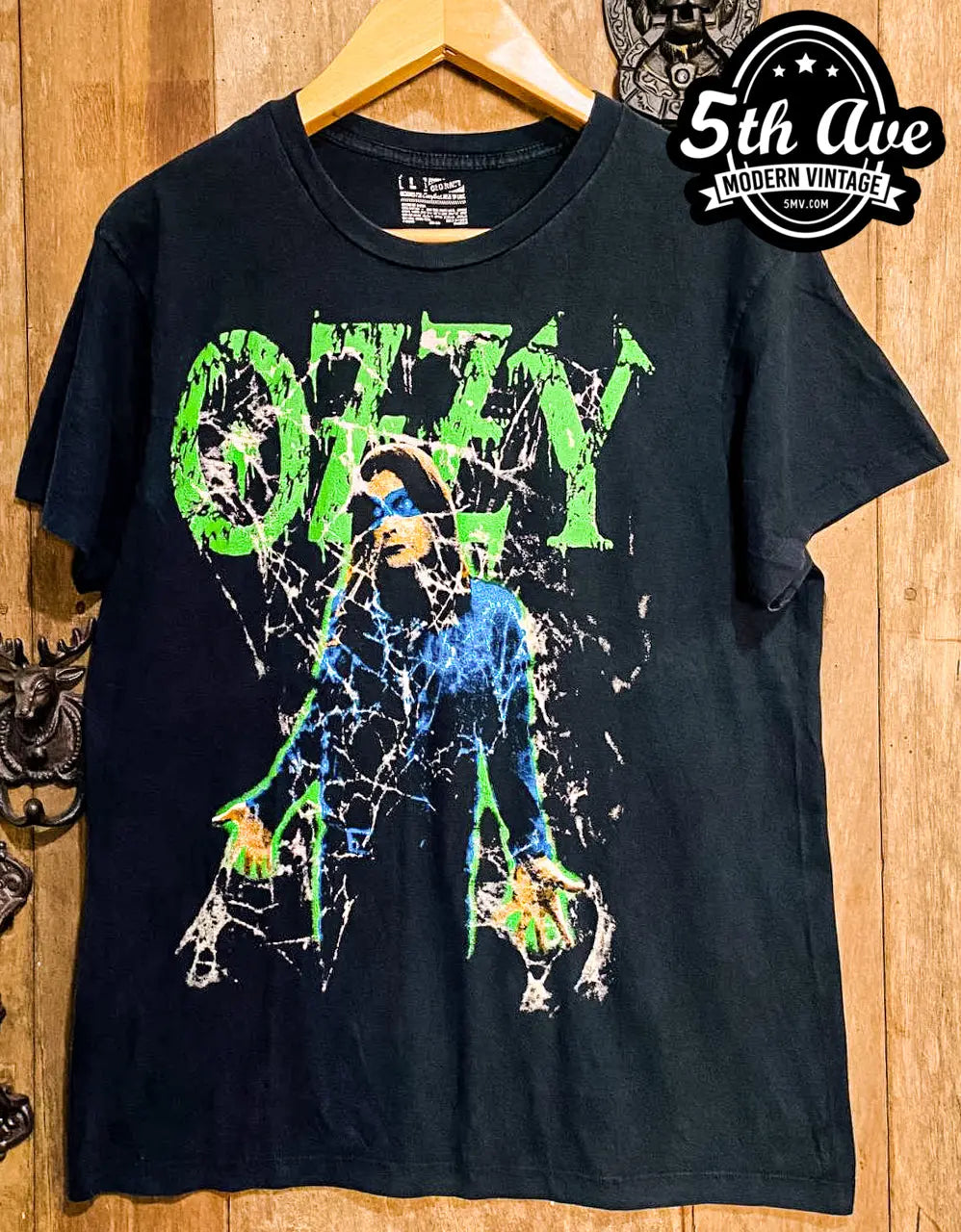 Ozzy Osbourne Cobweb Design Tee: A Hauntingly Stylish Tribute to the Rock Icon vintage band t-shirt on rack