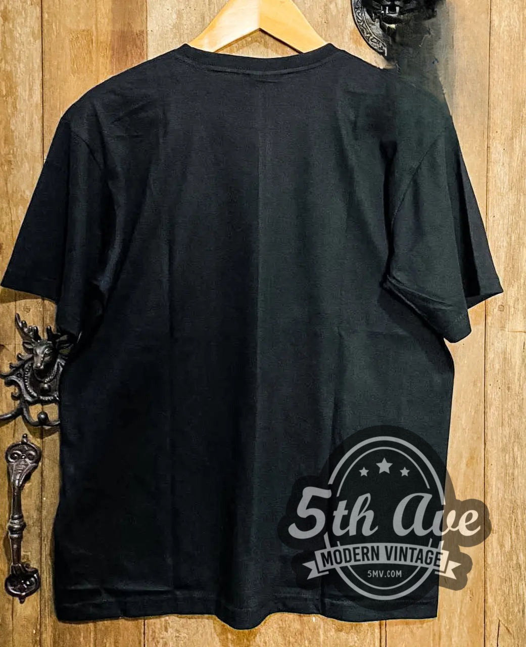 The Evil Dead - New Vintage Movie T-Shirt movie t-shirt hanging on a hanger