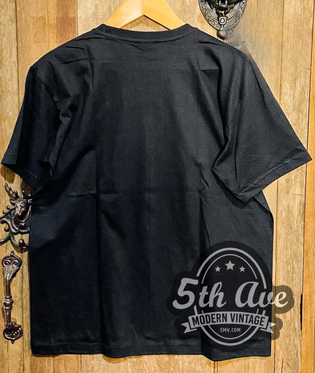 Child's Play – Chucky with Knife vintage movie t-shirt hanging on a hanger