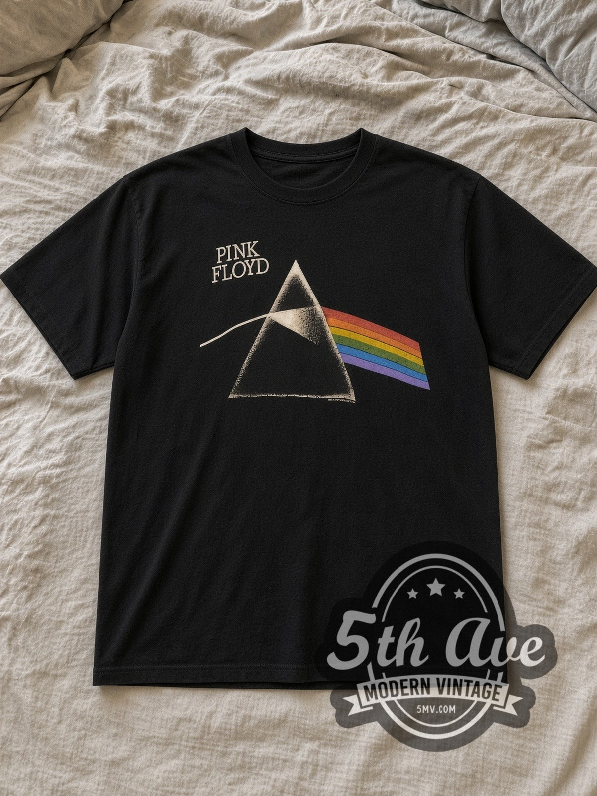 Black Pink Floyd Dark Side of the Moon' Prism Vintage Band T-Shirt laid flat on a linen bed