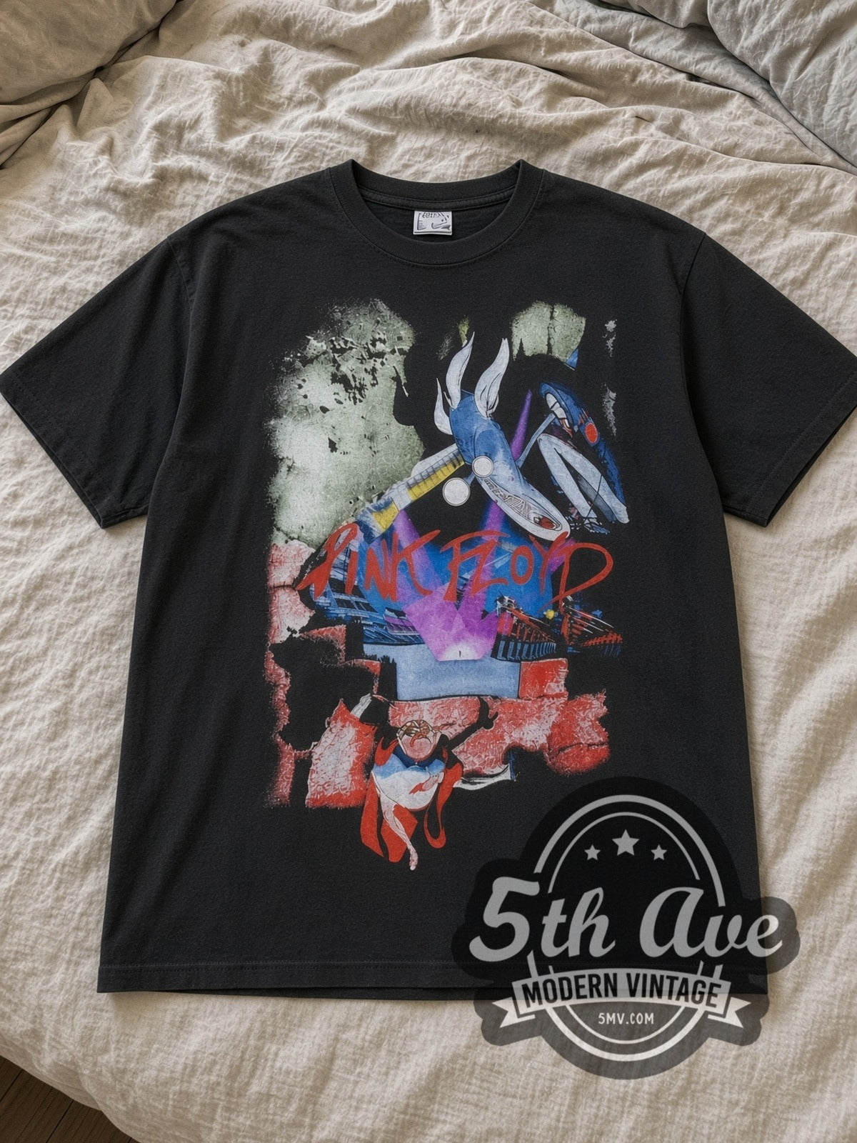 Black Pink Floyd The Wall Movie Collage Judge Vintage Band T-Shirt laid flat on a linen bed