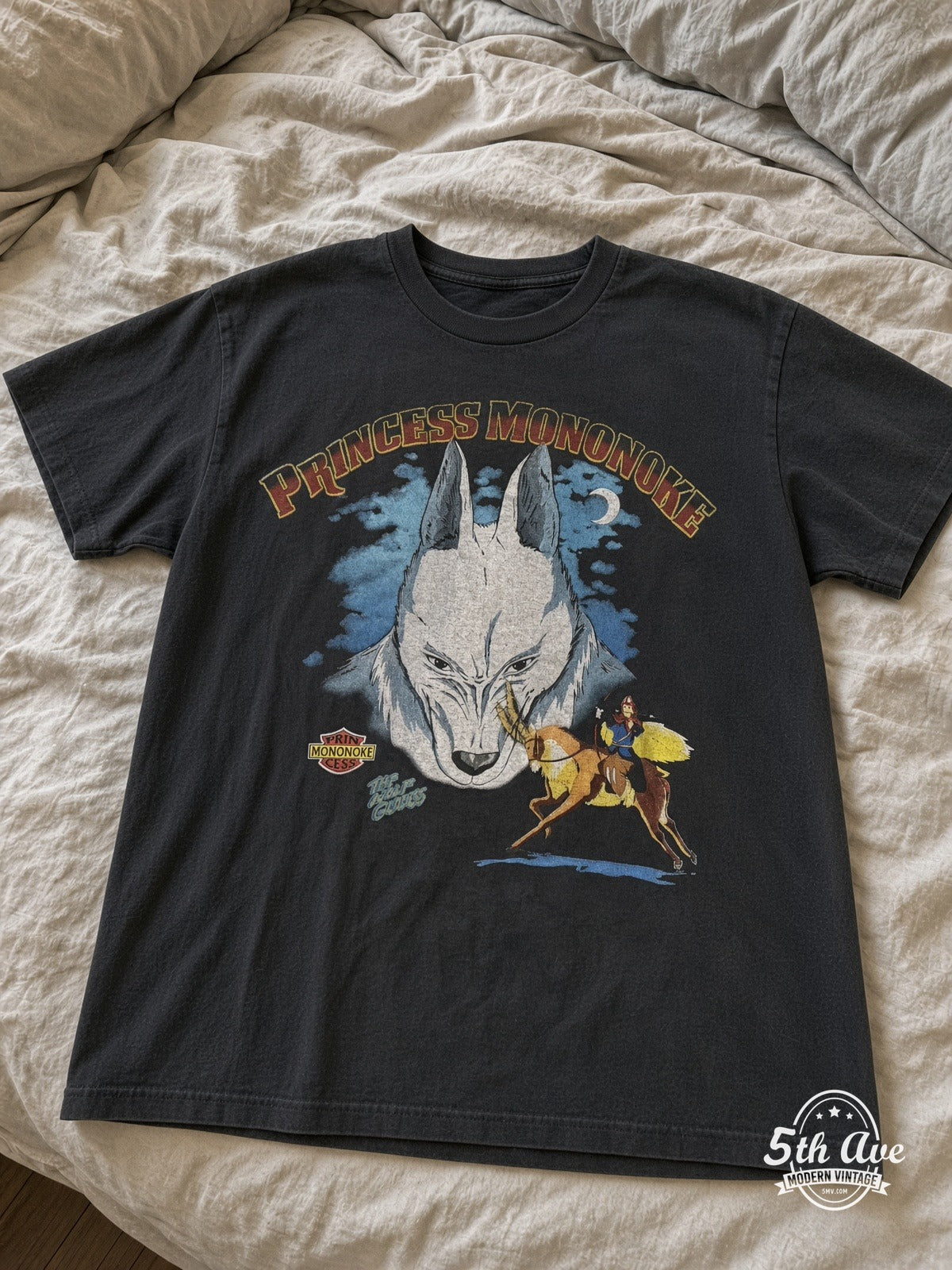 Princess Mononoke Wolf Gods Shishi Mask vintage tee laid on bed