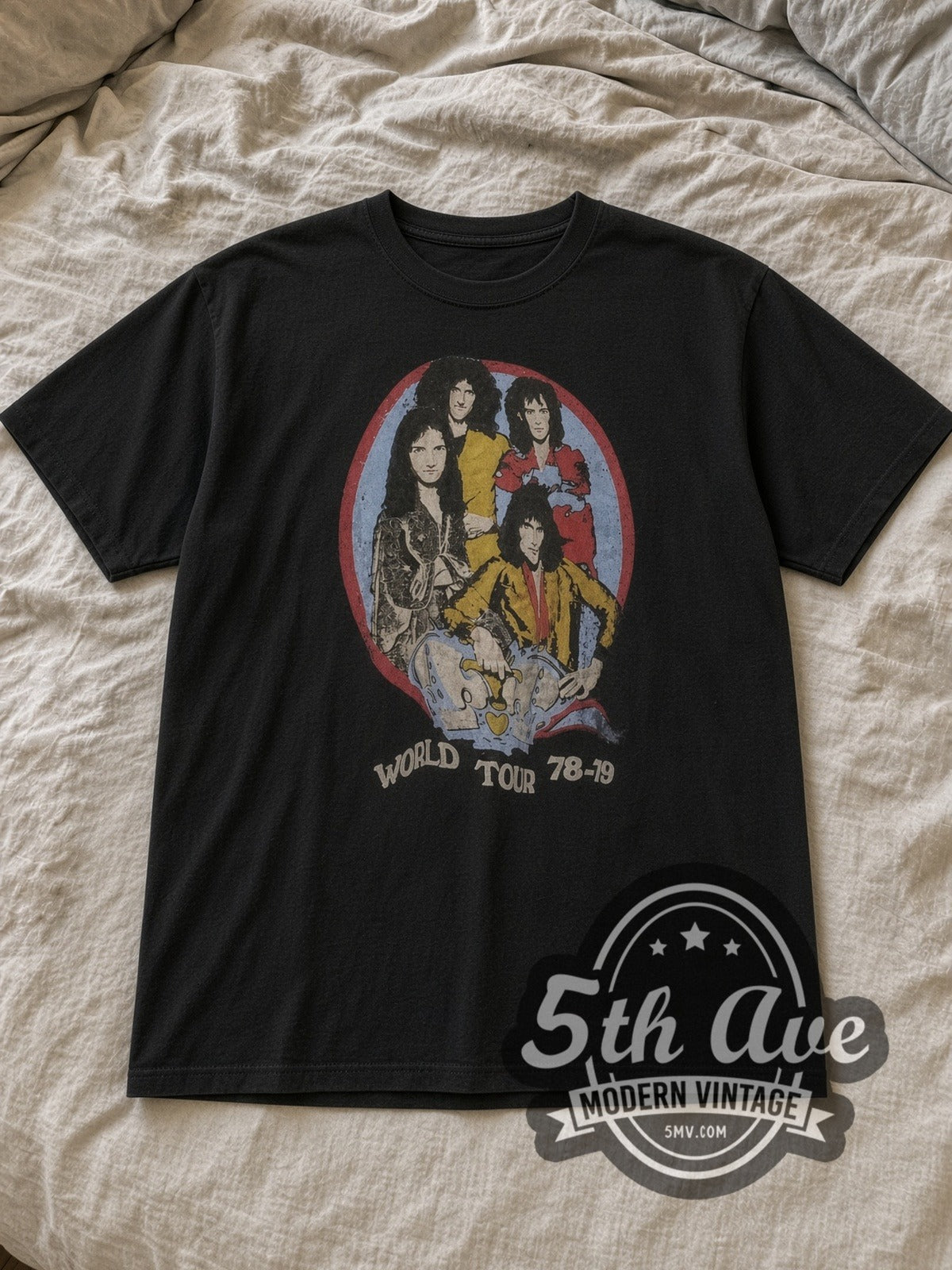 Black Queen World Tour 78 79 Circular Portrait Vintage Band T-Shirt laid flat on a linen bed
