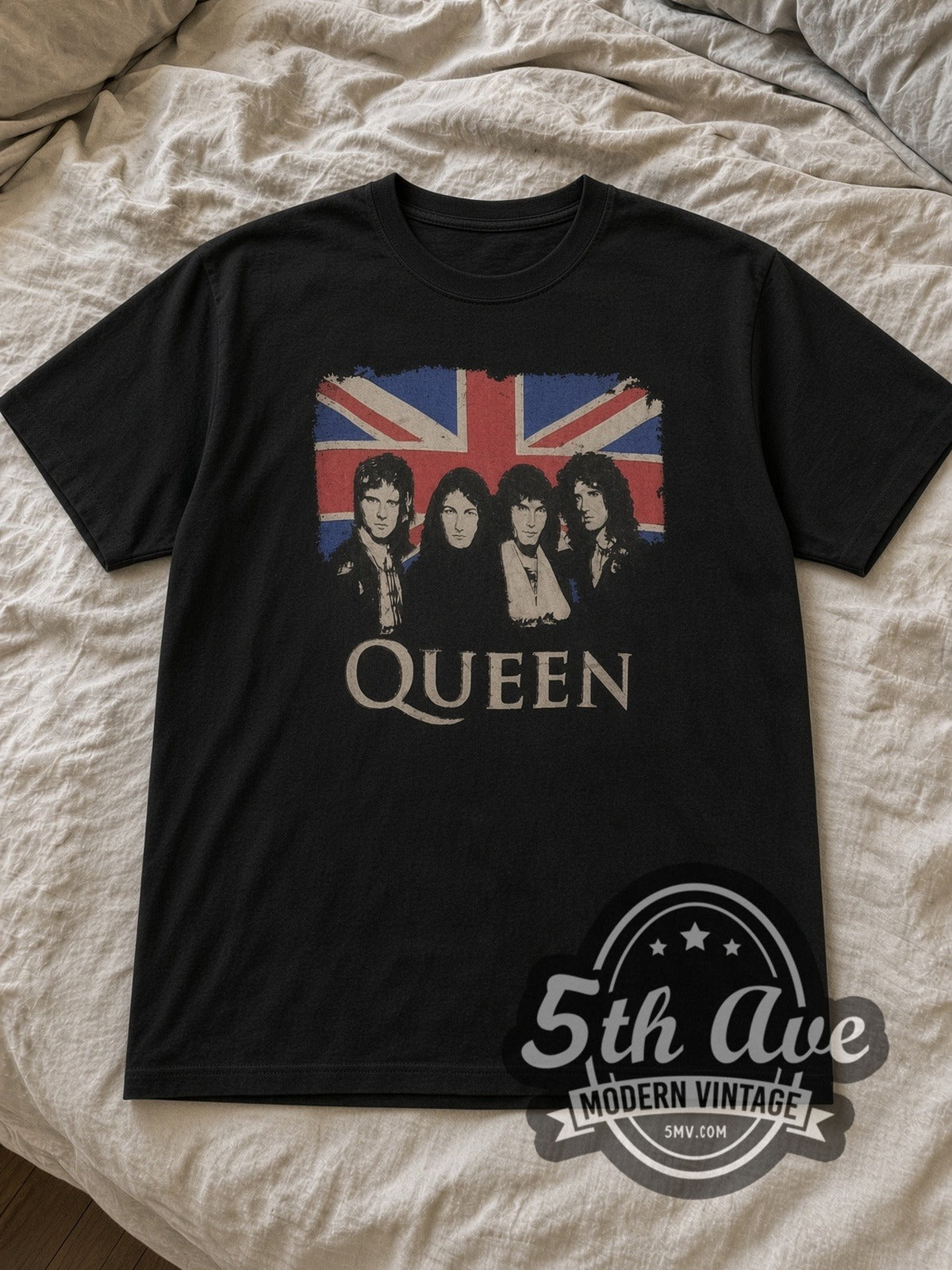 Black Queen Union Jack Band Portraits Vintage Band T-Shirt laid flat on a linen bed