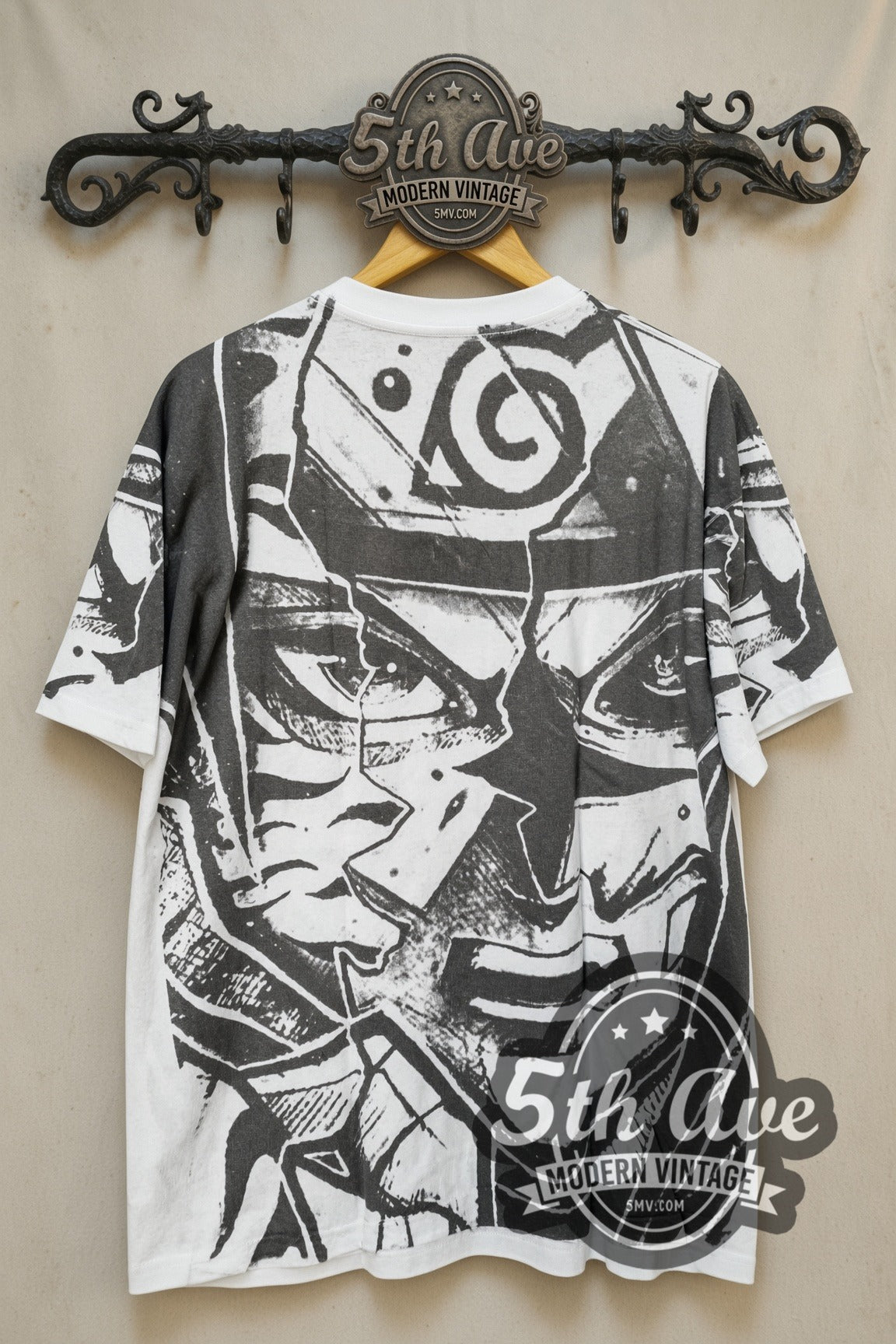 Naruto Shippuden Split Face Hidden Leaf all-over-print vintage graphic t-shirt, back view on a display rack