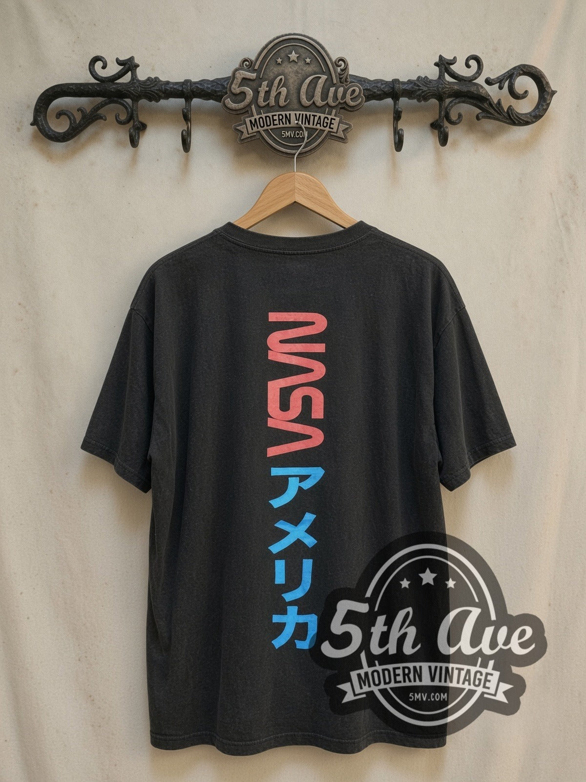 NASA vintage graphic tee, back view on a display rack