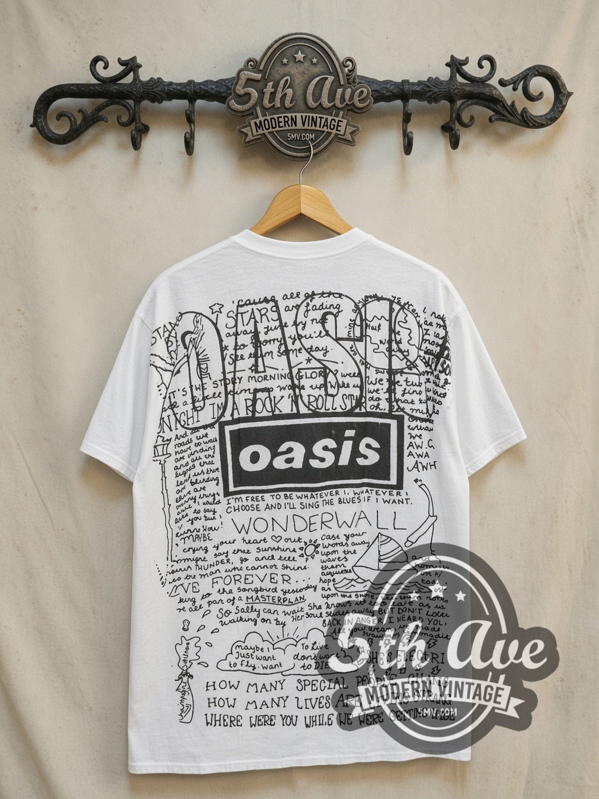 Oasis Loch Lomond and Knebworth vintage band t-shirt, back view on a display rack
