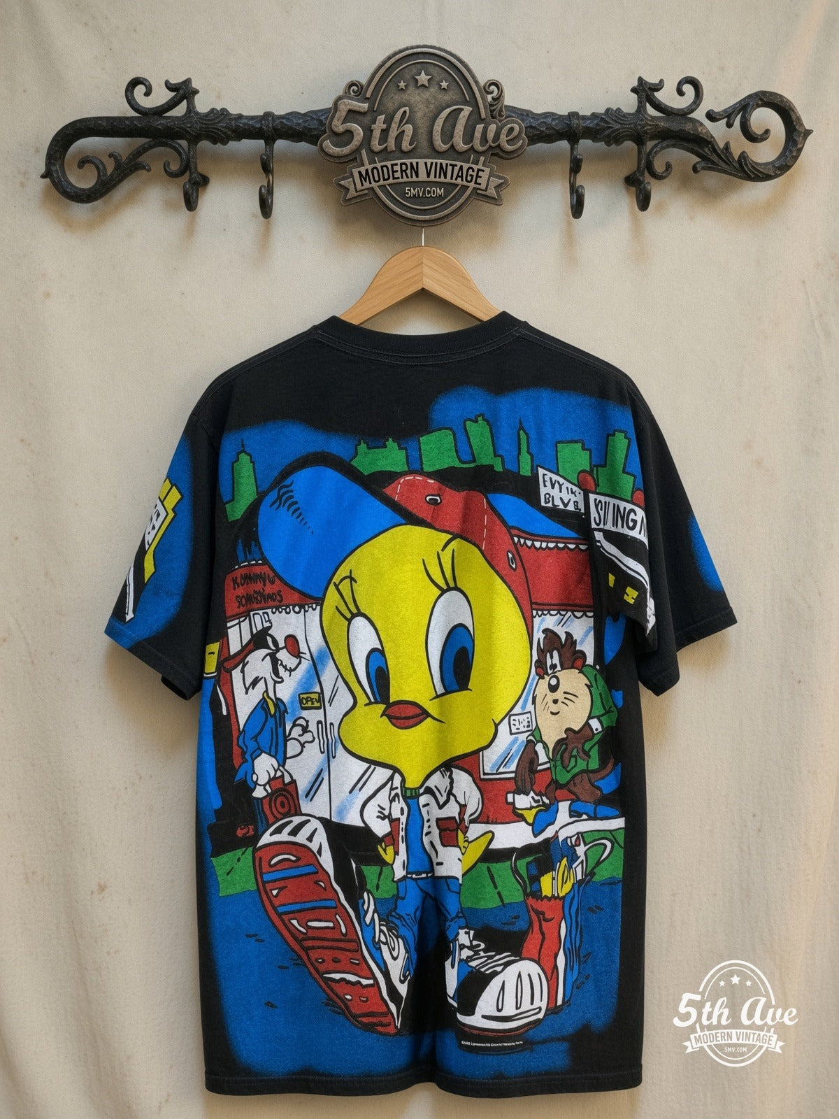 Looney Tunes – Tweety, Sylvester and Taz-Mania – All Over Print – New Vintage Graphic Tee — back on locked cream ornate 5th Ave rack