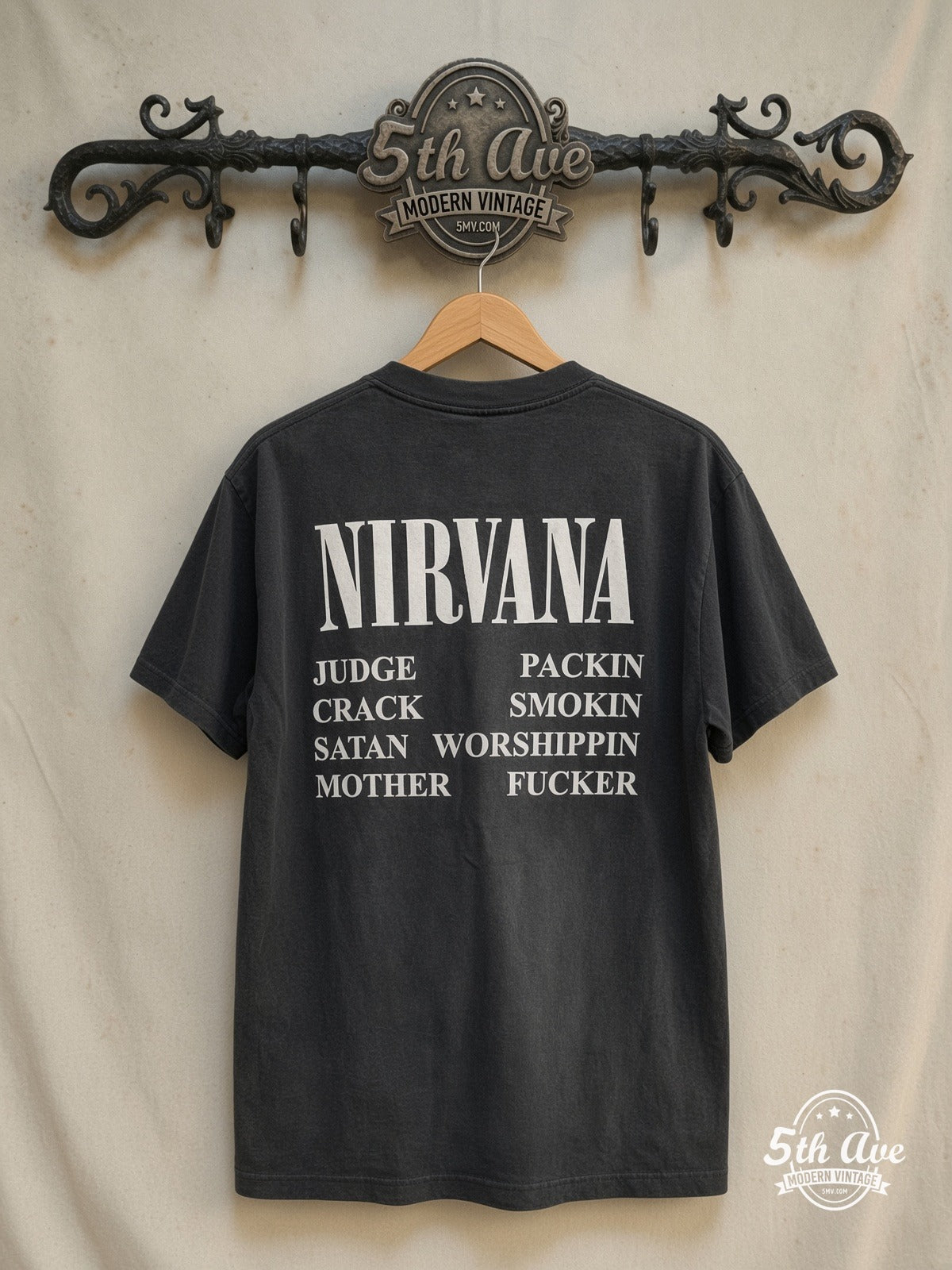 Nirvana – Incesticide – Vintage Band T-Shirt — back on locked cream ornate 5th Ave rack